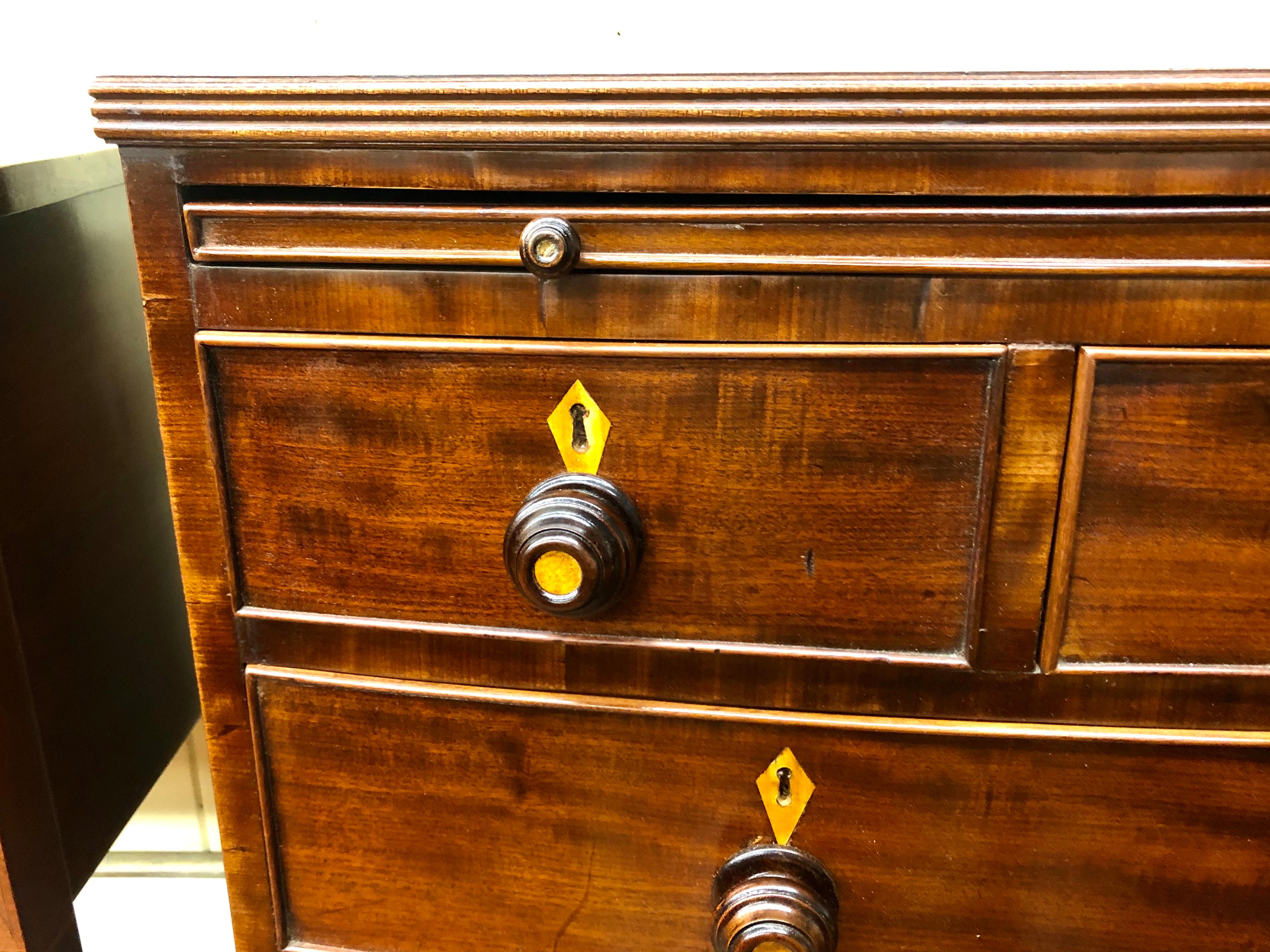Antique English Figured Mahogany Bowfront Chest with Brushing Slide In Good Condition In CHARLESTON, SC