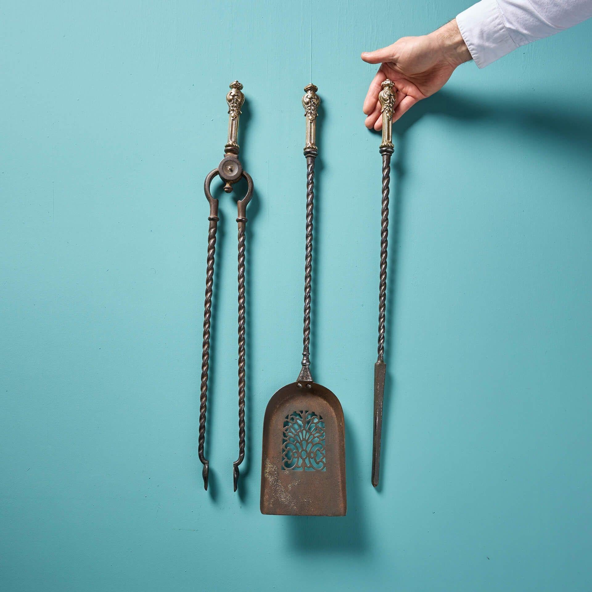 A set of antique Georgian steel fire tools with brass handles.

This fire tool set includes a poker, tongs and a pierced shovel. The perfect finishing touch to any fireplace!

Additional Information

Dimensions represent the largest piece (shovel).