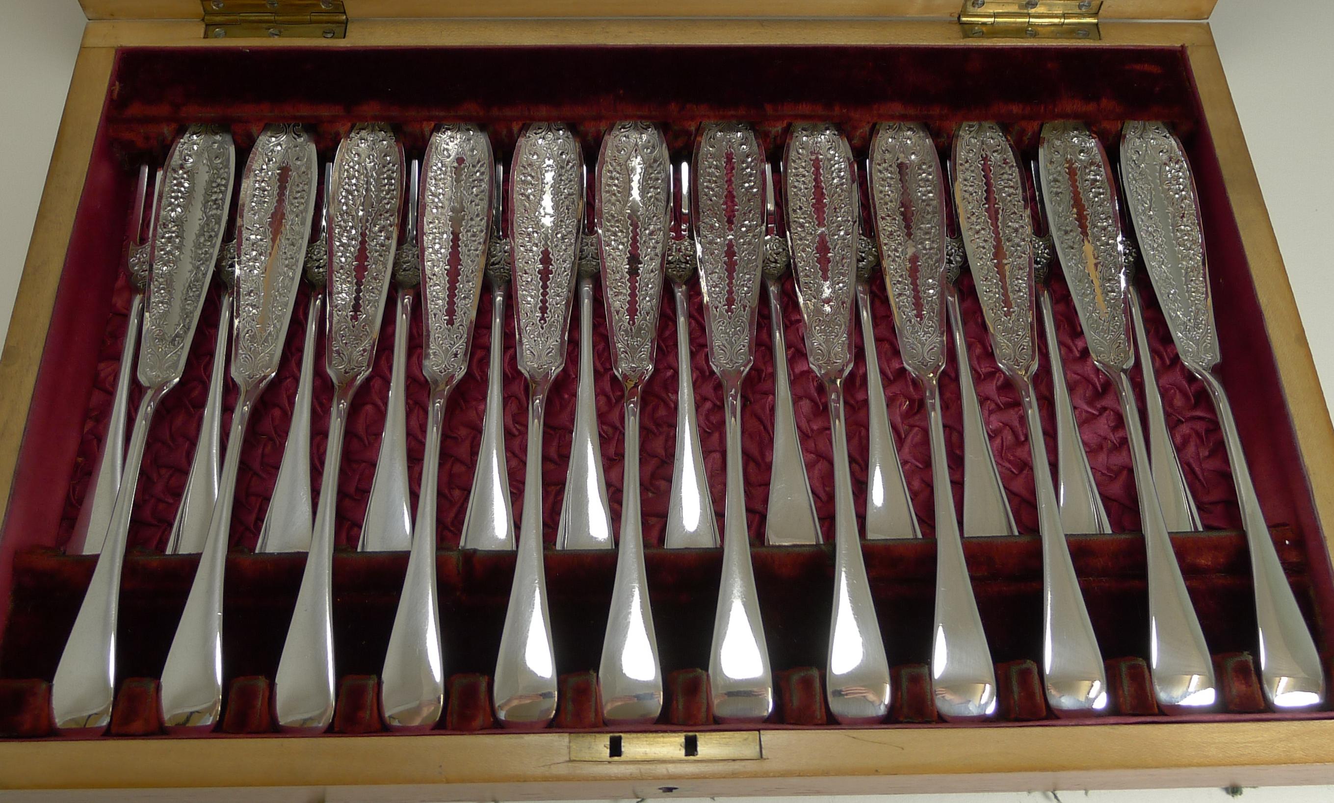 A fabulous and very grand set of fish knives and forks for twelve complete with the matching fish servers fitted inside the lid.

The set is complete and comes in the original Mahogany presentation case inlaid to the lid. The interior is a joy,