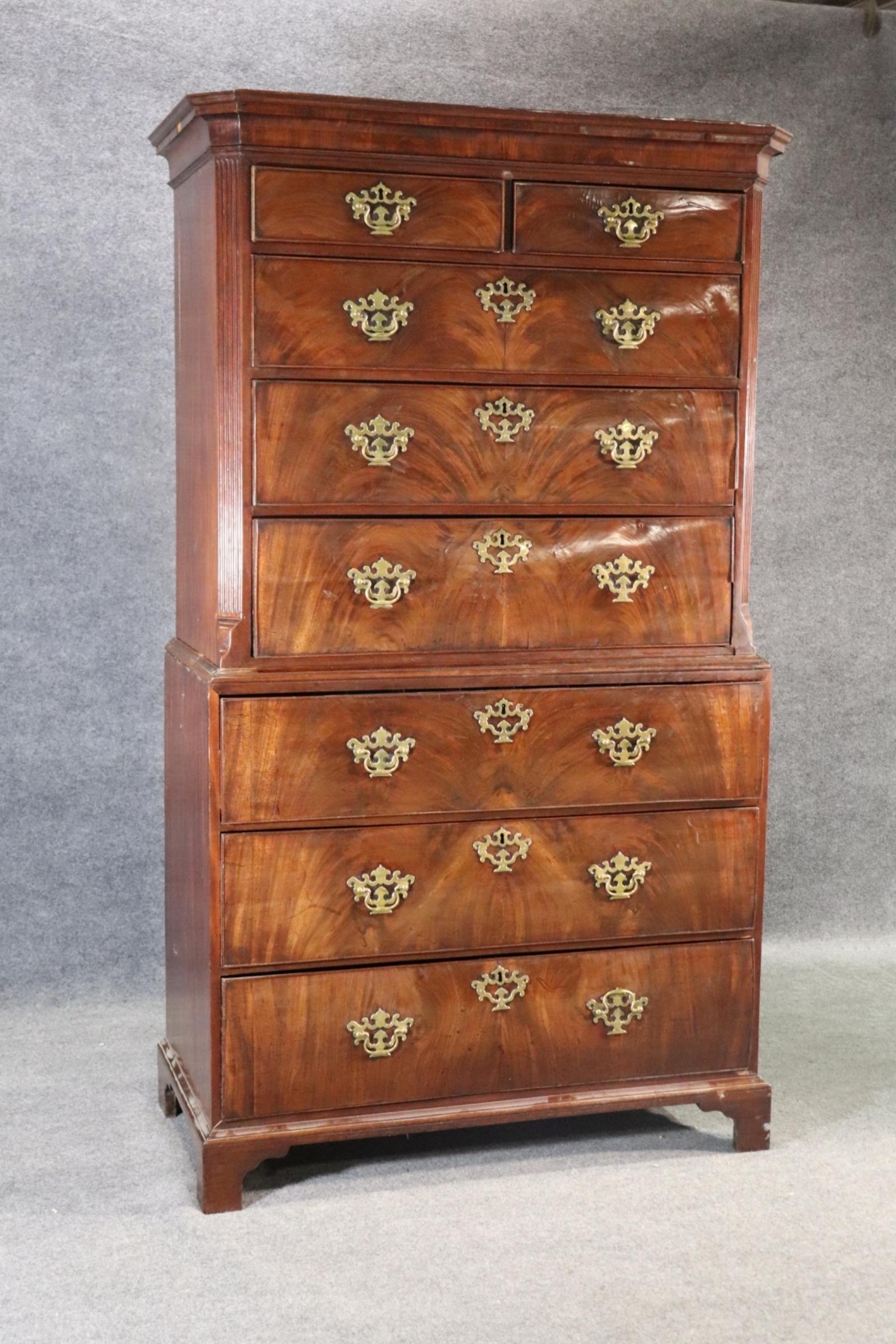 Antique George III walnut Chest on Chest.  The chest is  2 pieces. The top piece has 5 dovetail drawers. The bottom has 2 dovetail drawers and drop-down desk. 

Dimesnions: 75 5/8