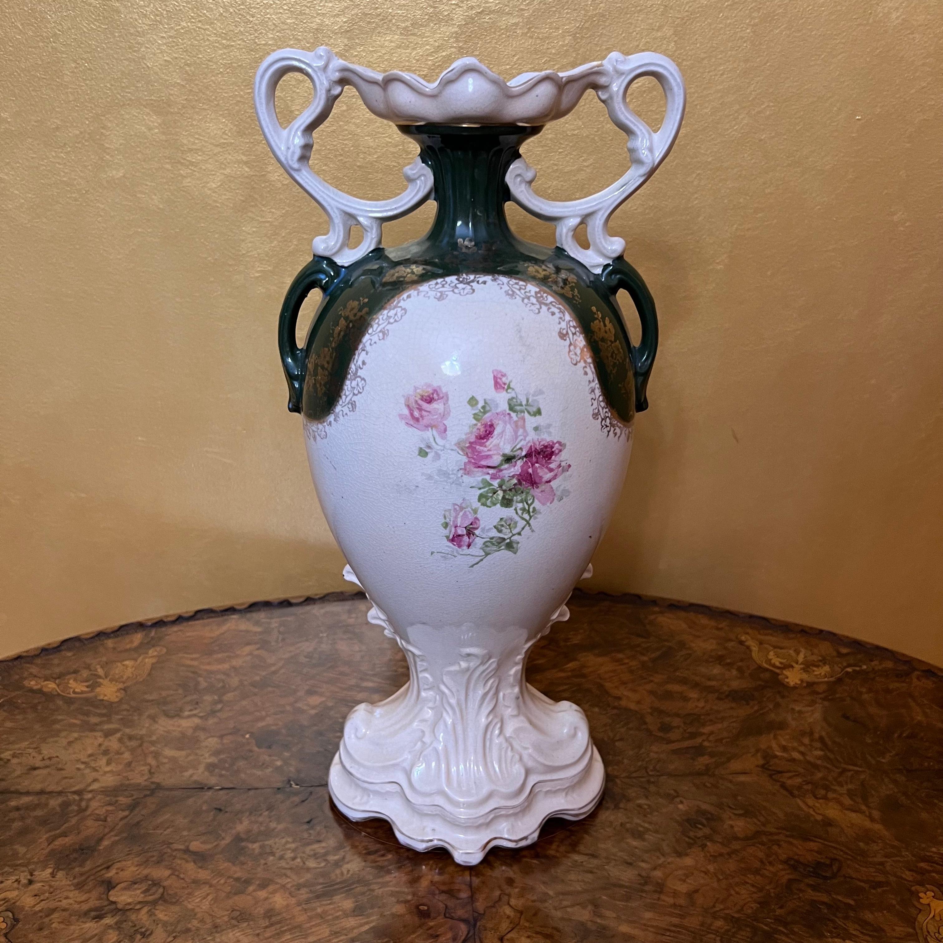 Floral painted vase with gold detailing, ware and fade to gold due to age, crazing and small chip to front rim. Beautiful display pieces. 

Circa: Early 20th Century 

Material: Porcelain

Country Of Origin: England 

Measurements:43cm high, 20cm
