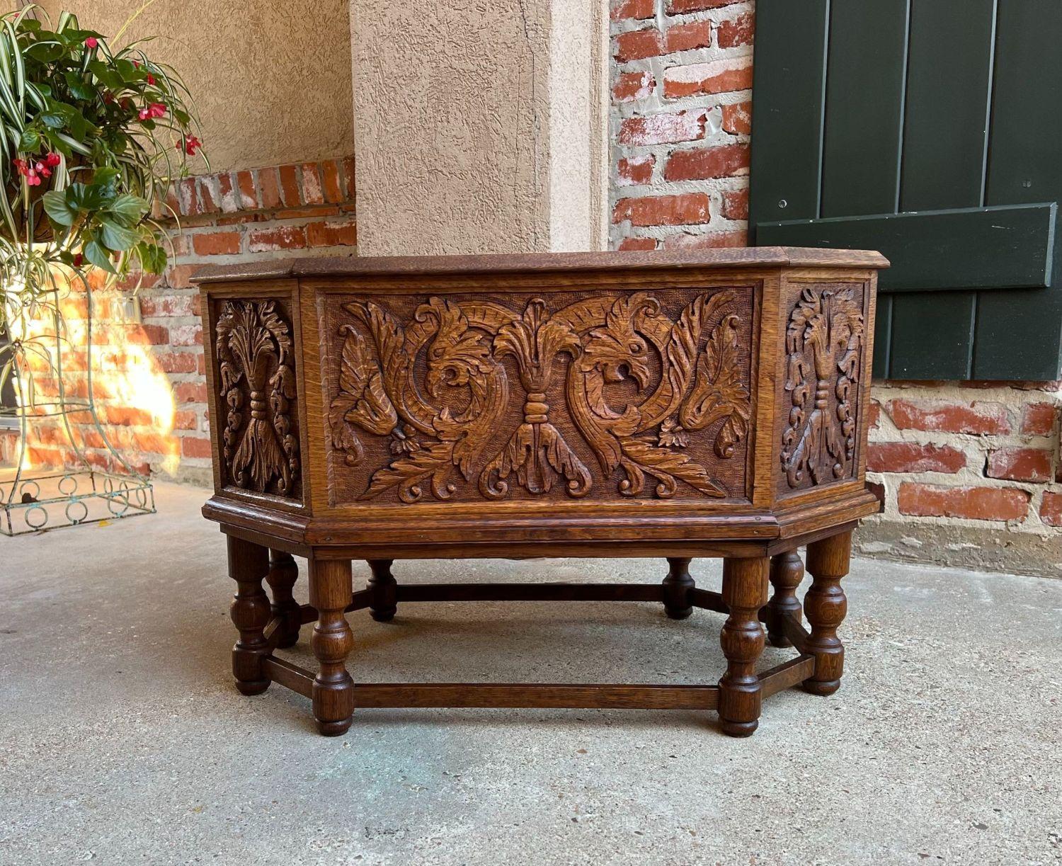 Antique English flower planter drink wine server Carved Oak w Liner.

Direct from England, a wonderfully hand carved planter or wine cellarette! This would also be fabulous sitting by the fireplace to hold logs and kindling! The design lends