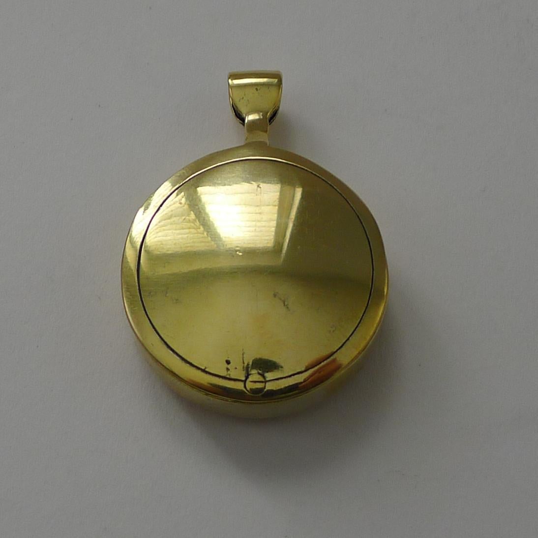 A brass folding pocket compass which is made also to be added to a chain or ribbon to be worn around the neck.

The lens has a good magnification and in lovey condition.

Dating to c.1910, the brass case has been professionally cleaned.  Excellent