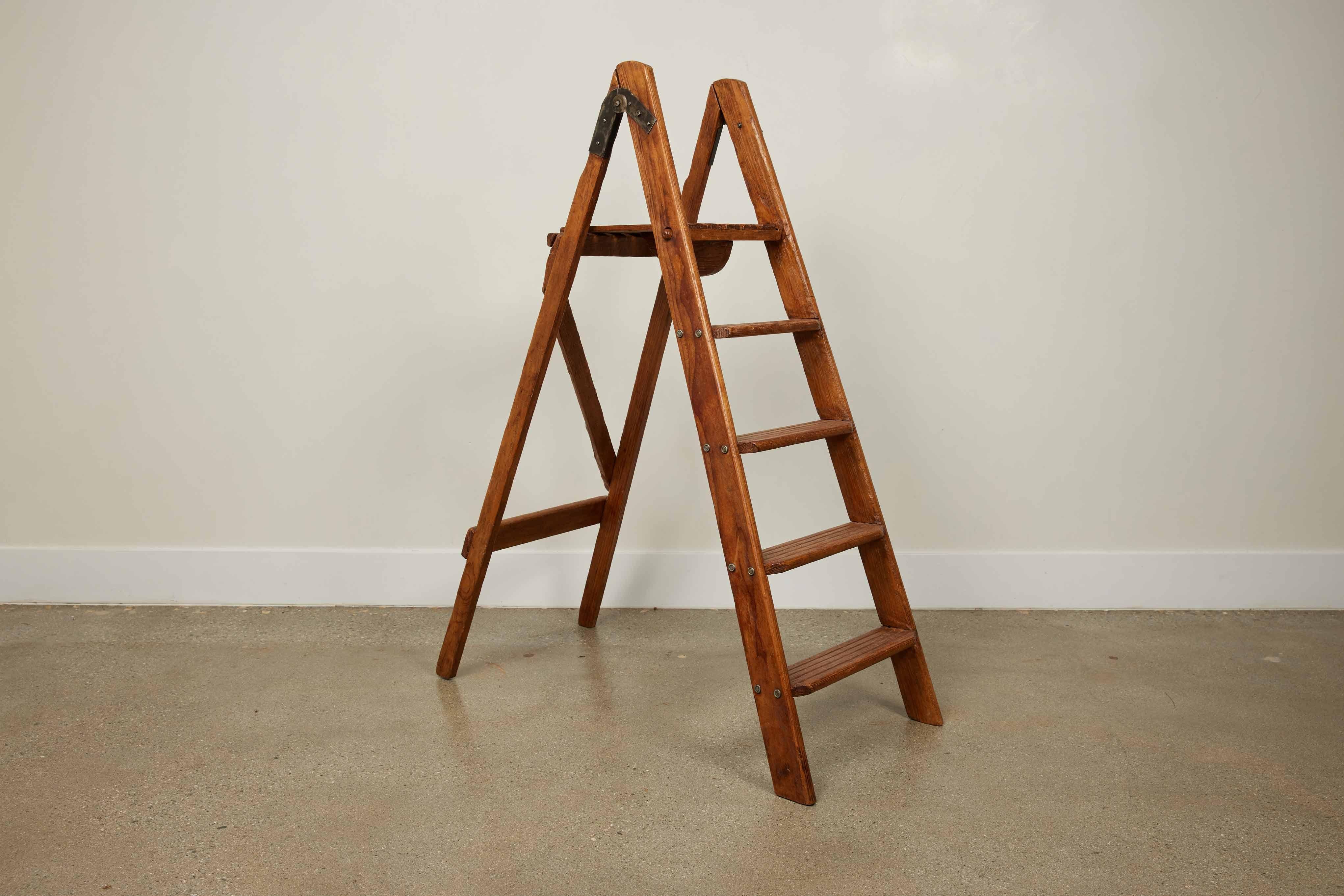 Antique English Folding Library Step Ladder, 1800s adorned with aged iron hardware.

This exquisite antique English library ladder, dating back to the 1800s, is a testament to the unmatched craftsmanship of the period. This folding ladder stands as