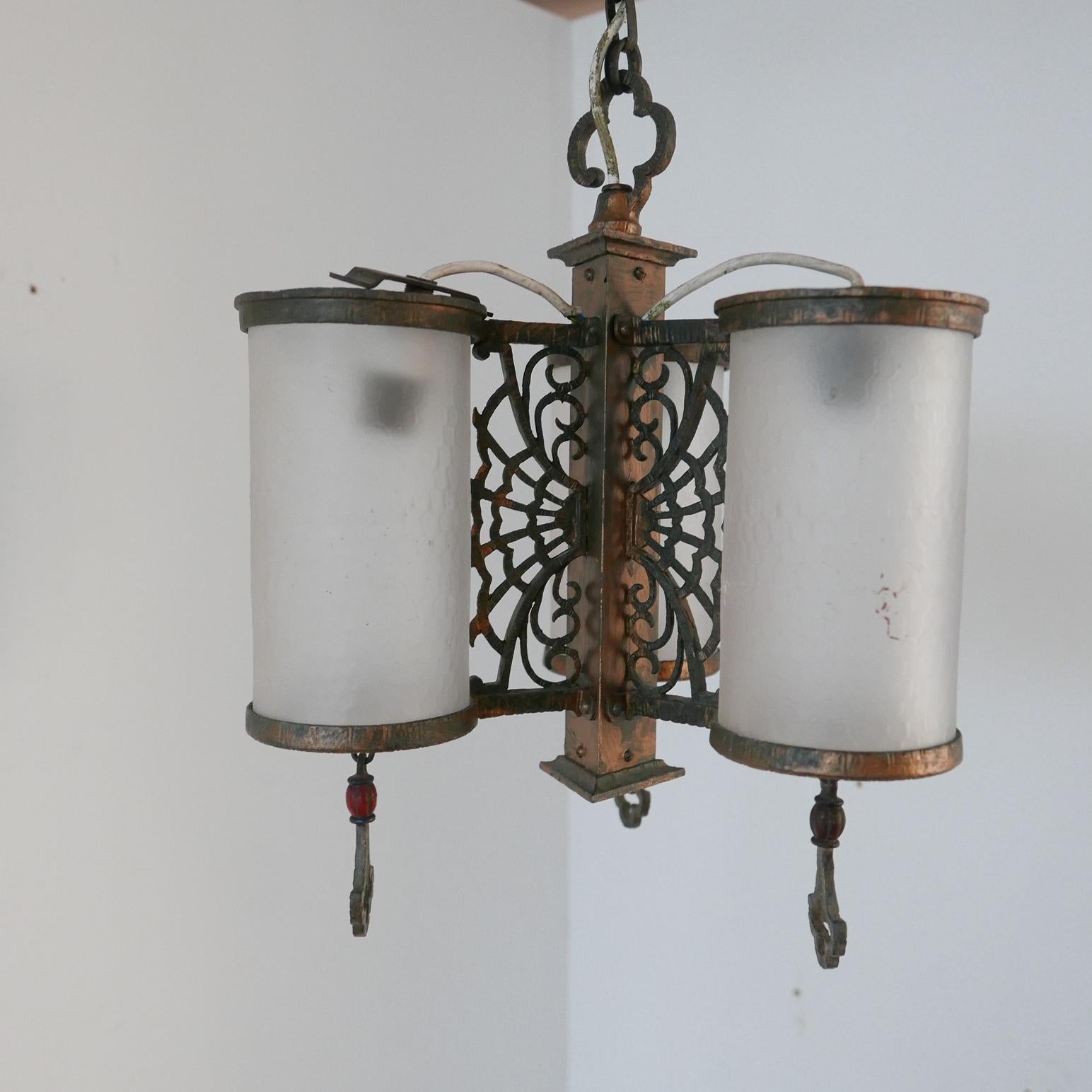 Antique pendants with frosted glass and patinated brass. 

England, c1920/30s.

Oriental homage design that is almost spider web in form. 

Original chain and rose retained. 

Two available. 

Re-wired and PAT tested.

Priced and sold