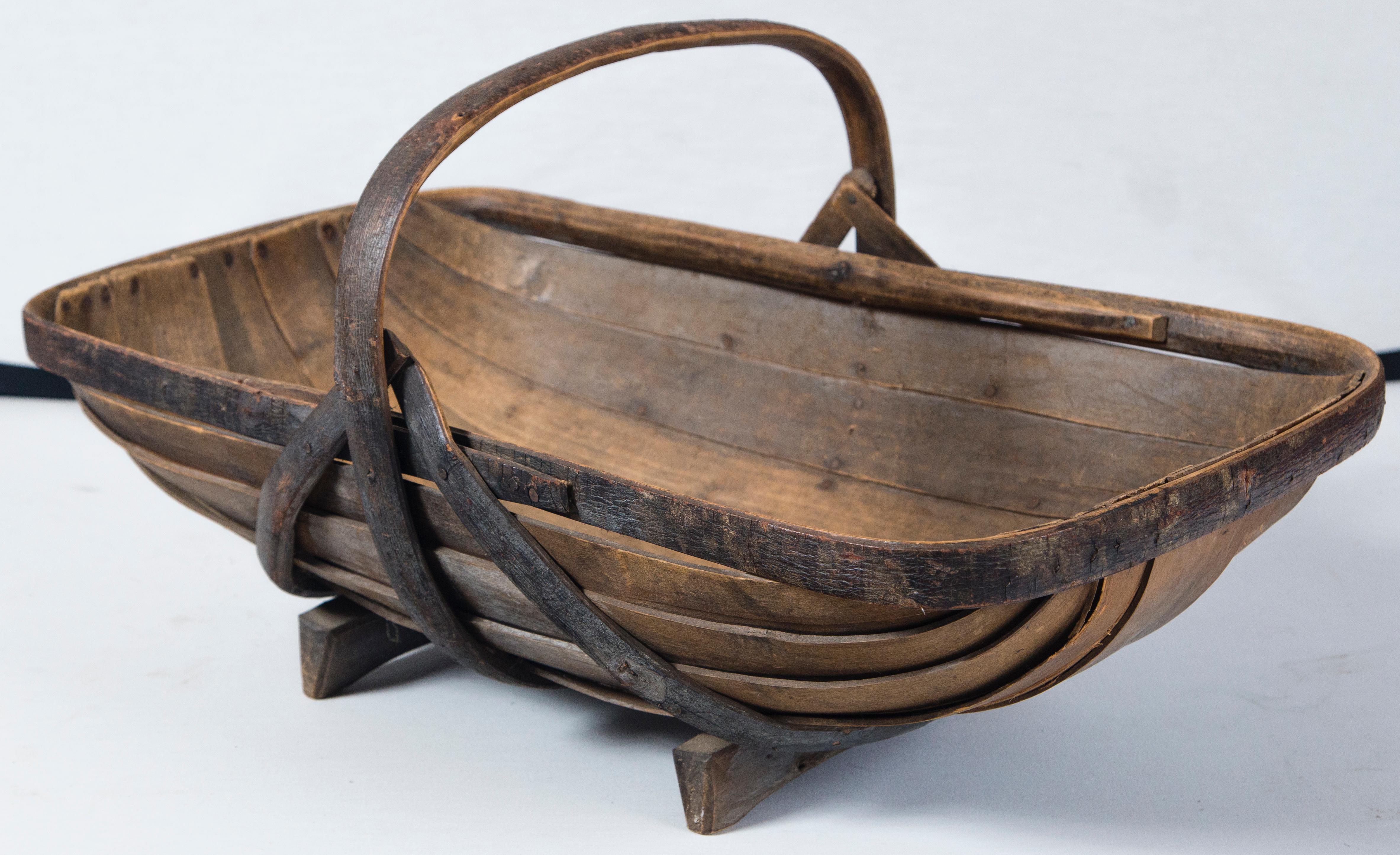 Antique English garden trug, circa 1910. A rare, extra large size to carry cut flowers from the garden. Bentwood construction with wonderful aged surface.