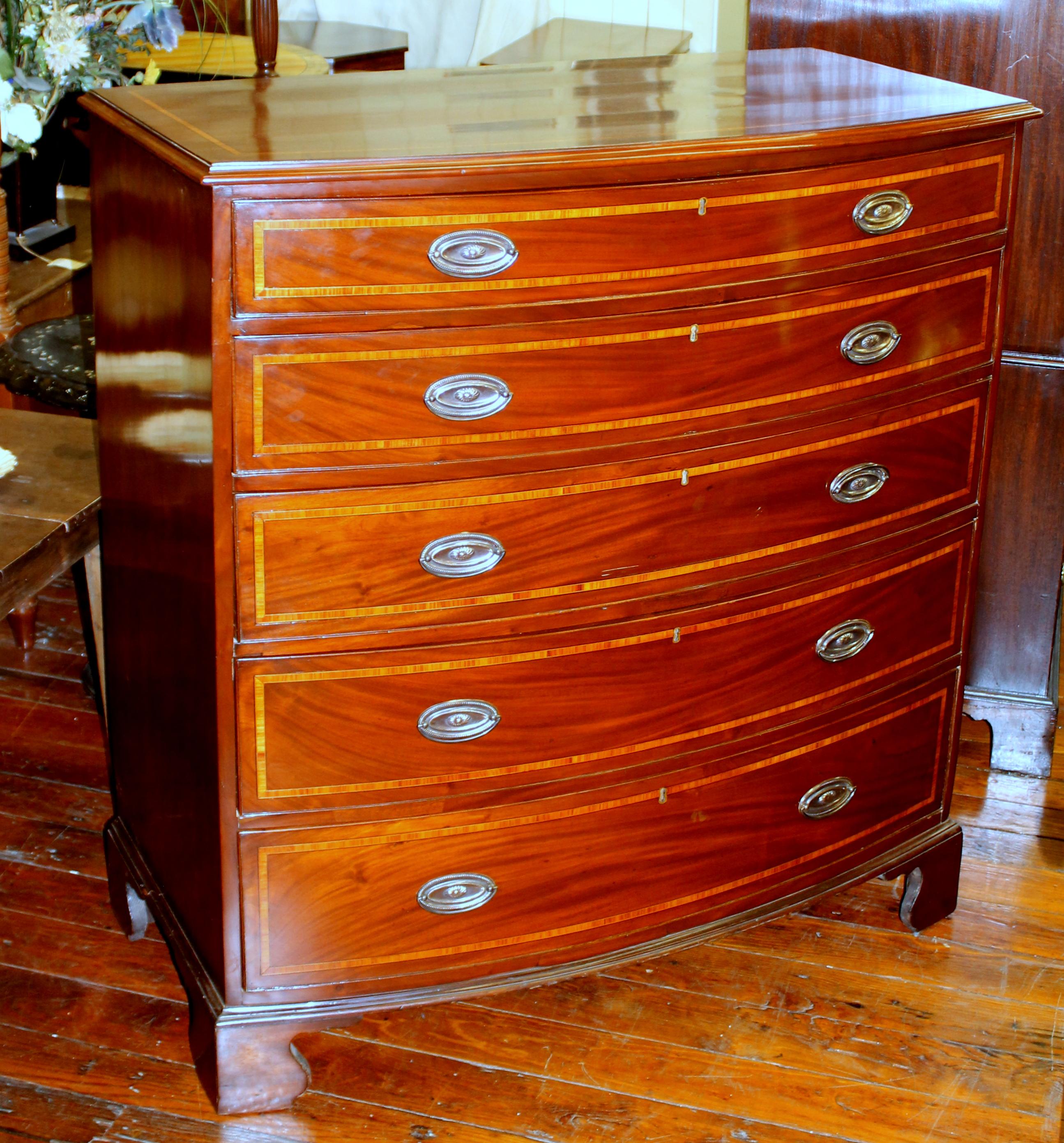 Rare and fine antique English George IV tulipwood tall inlaid mahogany bow-front chest of drawers with five rare, wide graduated drawers (sometimes known as a 
