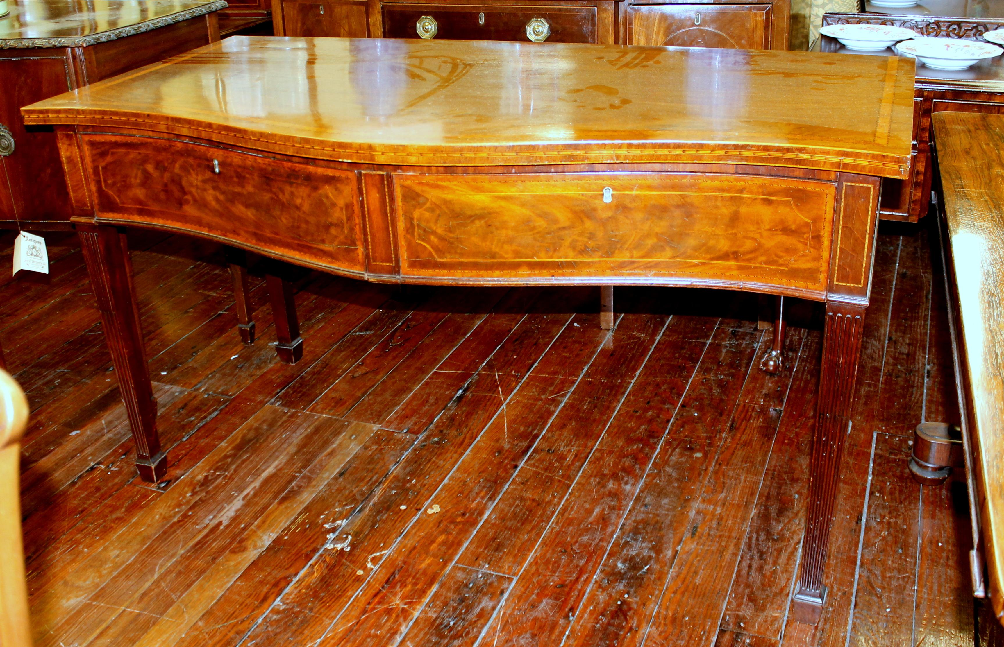 Fabulous quality antique English George III inlaid figured mahogany hunt-board, console or server with book-matched flame mahogany drawers and fabulous inlays throughout; unusually deep and useful size.

Please note exceptional satinwood and