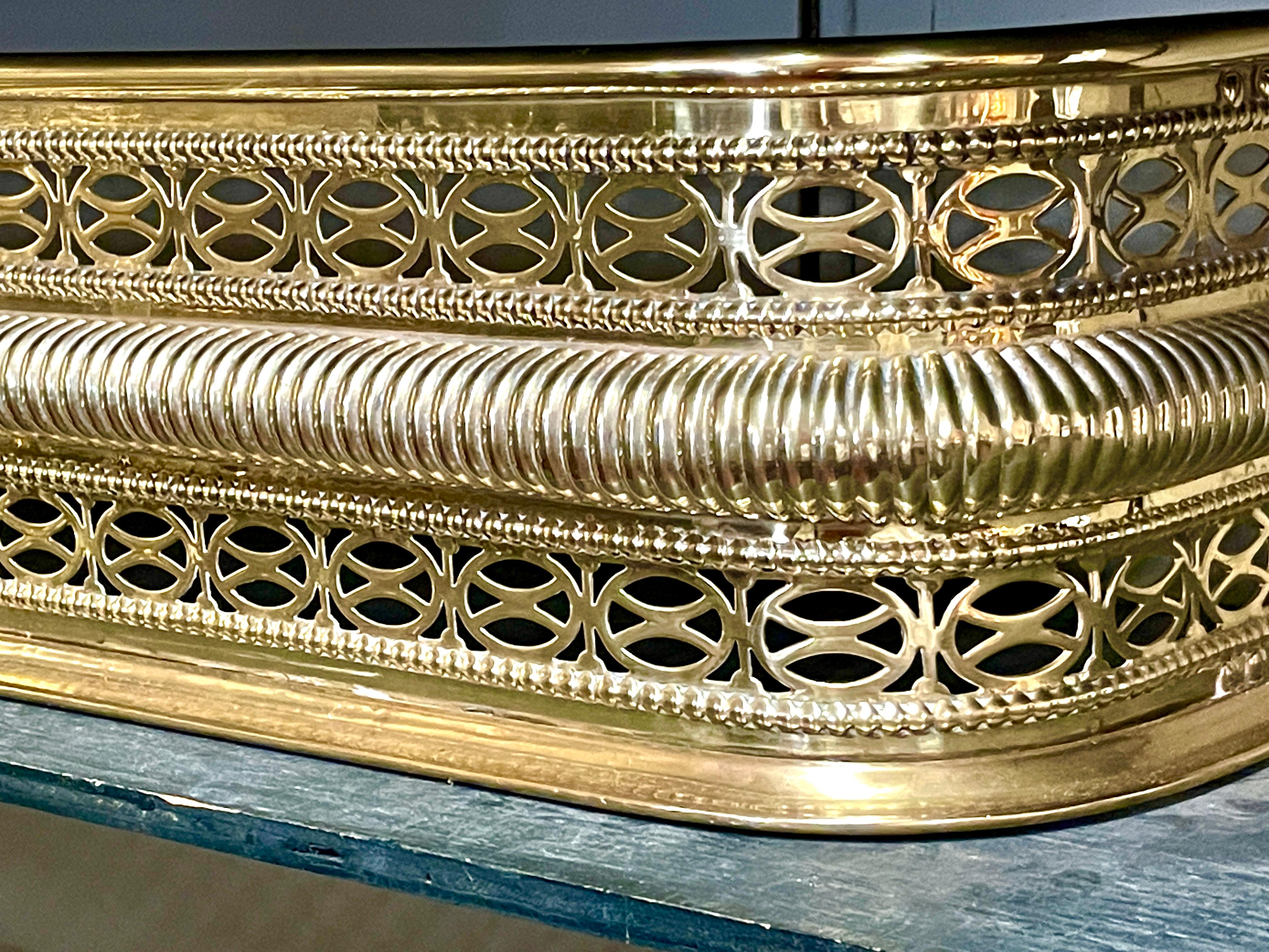 Hand-Crafted Antique English George III Intricately Pierced Brass Fireplace Fender For Sale