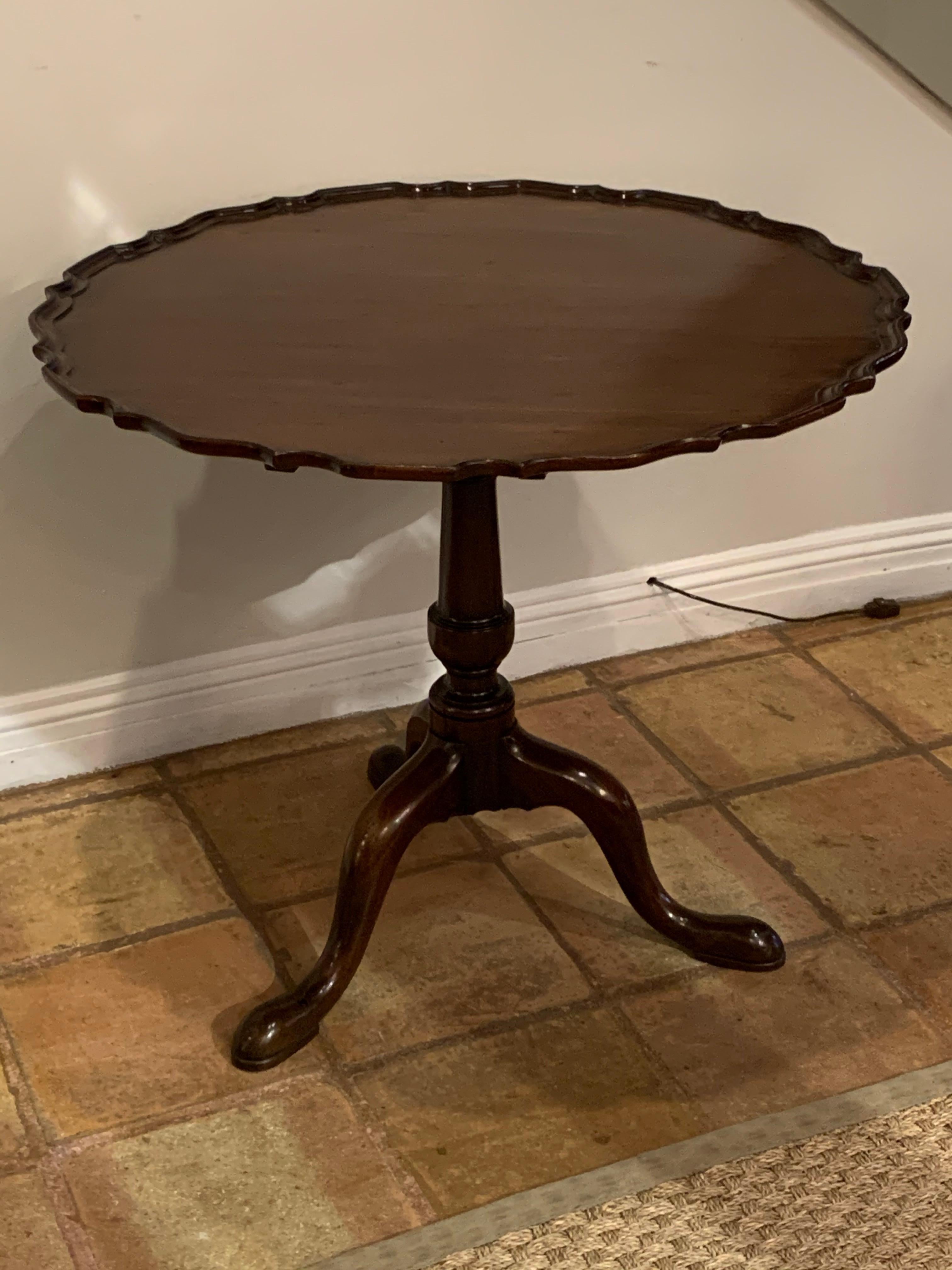 Antique English George III mahogany pie crust table.