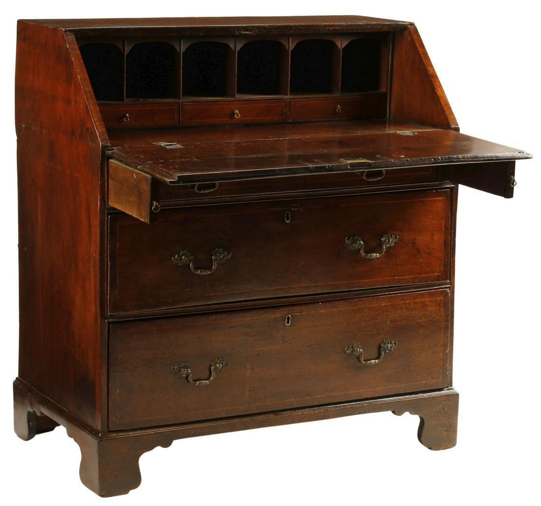 Antique English George III mahogany inlaid slant front secretary writing desk, 19th c. This desk features a thin line of inlay surrounding the slanted desk top and each drawer. The brass key holes and drawer handles are original. The interior has
