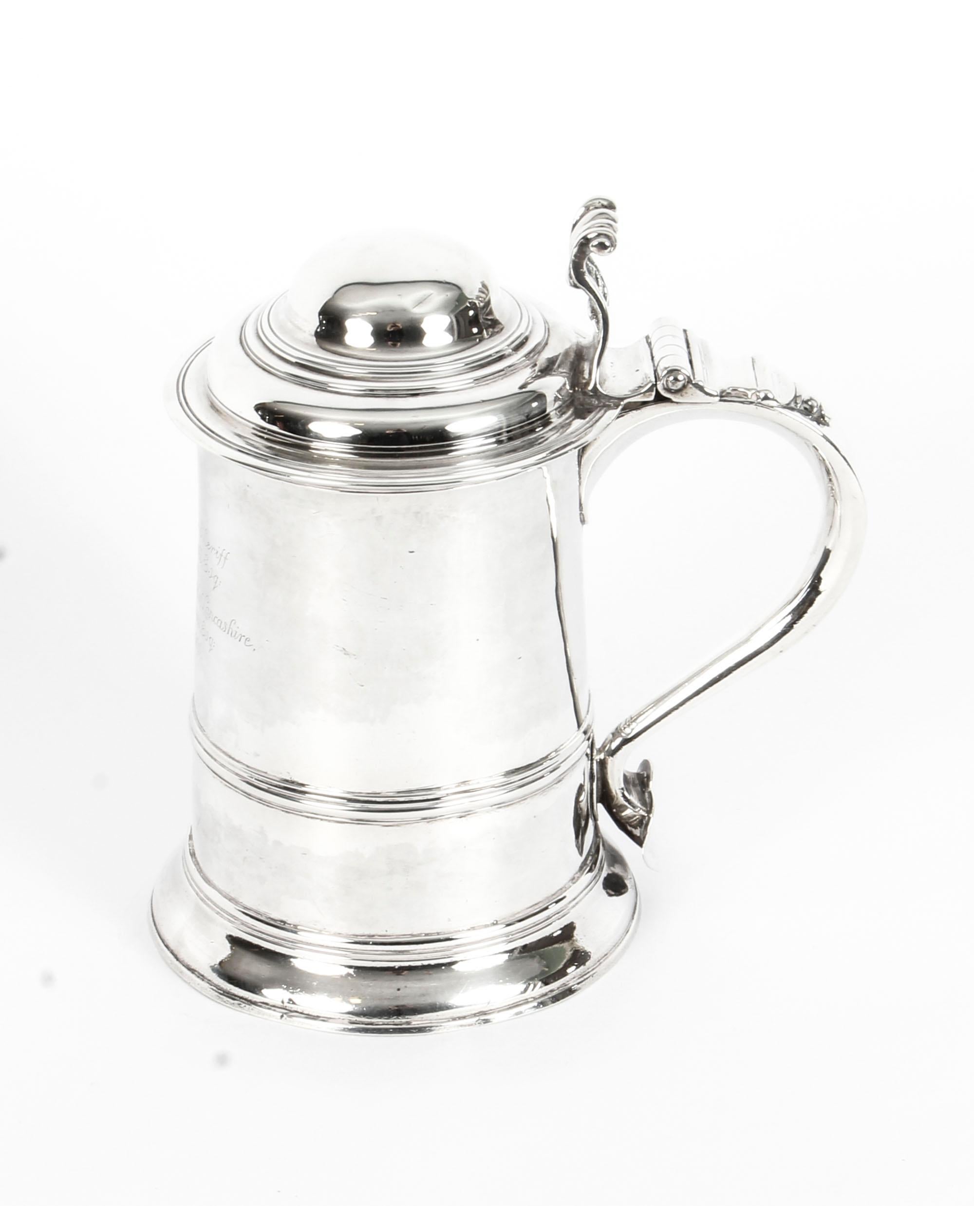 This is a fantastic large antique English George III sterling silver tankard/ beer stein with hallmarks for London 1759, and makers' mark of Thomas Whipham & Charles Wright. 
 
This exceptional beer tankard has a plain tapering cylindrical form onto