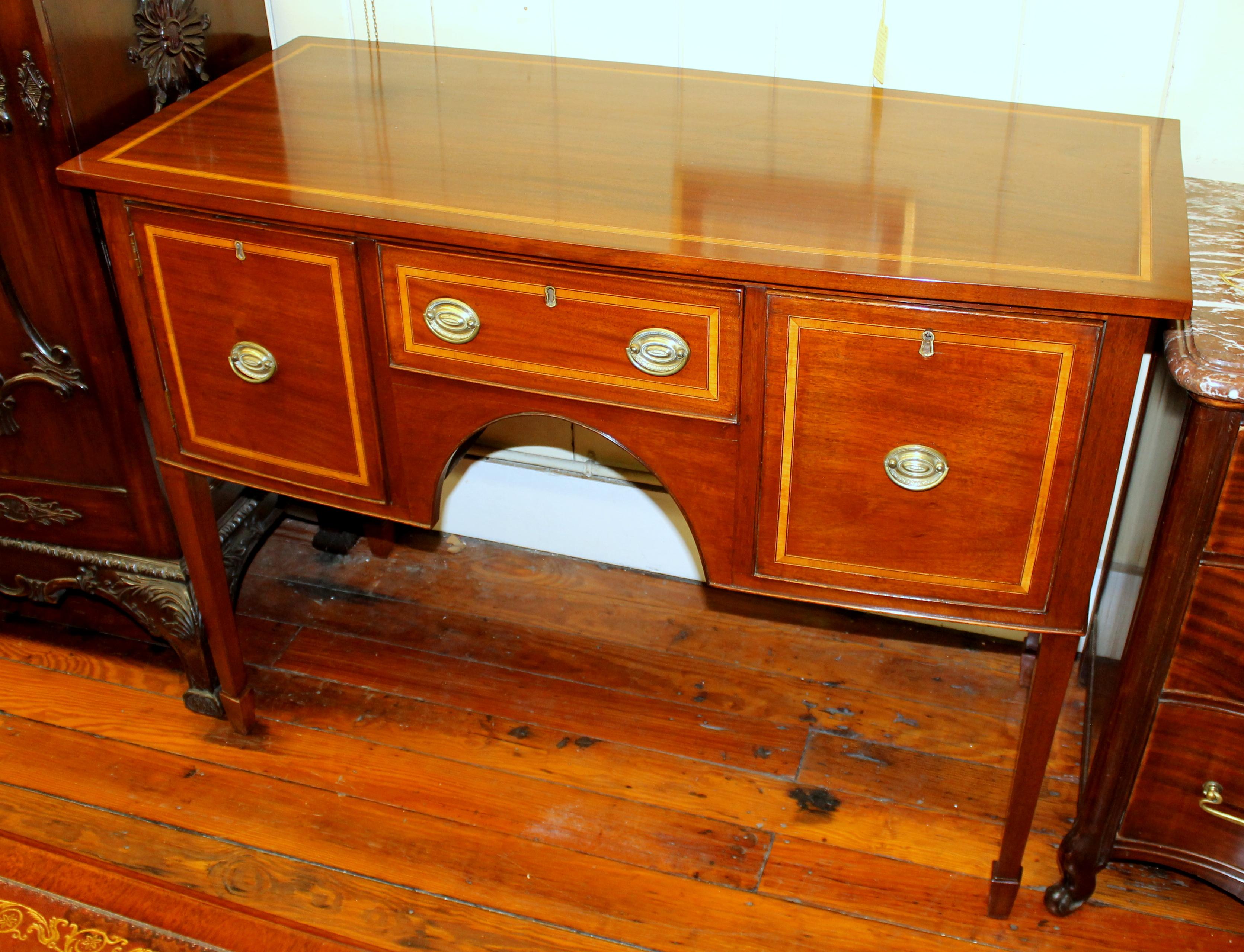 Fine antique English George IV inlaid mahogany Hepplewhite style small sideboard with original handles
Lovely useful diminutive size. Right side cellarette drawer; with hinged cupboard door to the left side.
Pristine condition.