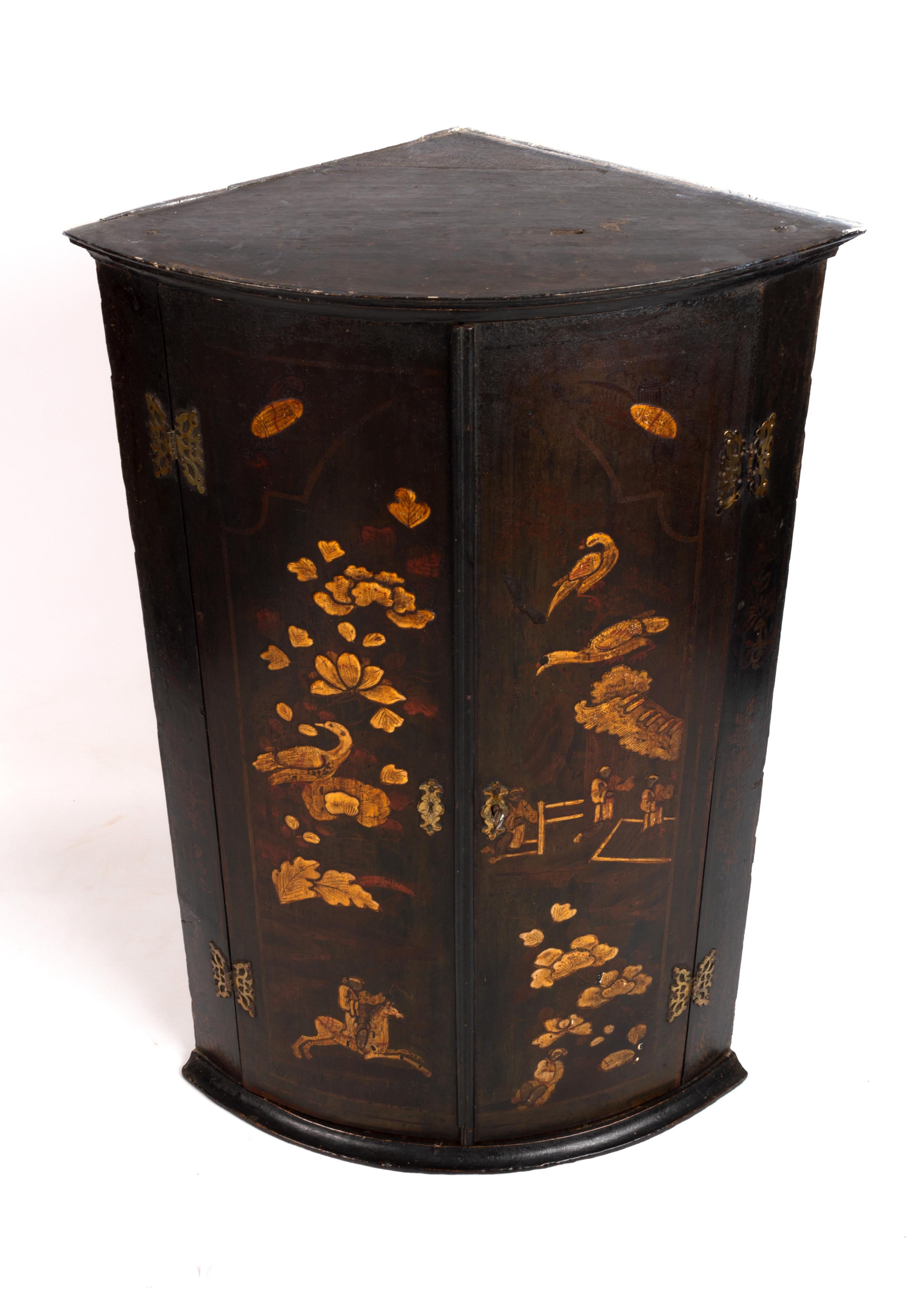 Antique English Georgian chinoiserie lacquered hanging bow front corner cupboard, 1780.

A George I period 18th century chinoiserie lacquered bowfronted corner cupboard; the corner cupboard's doors lacquered with oriental style raised gilt