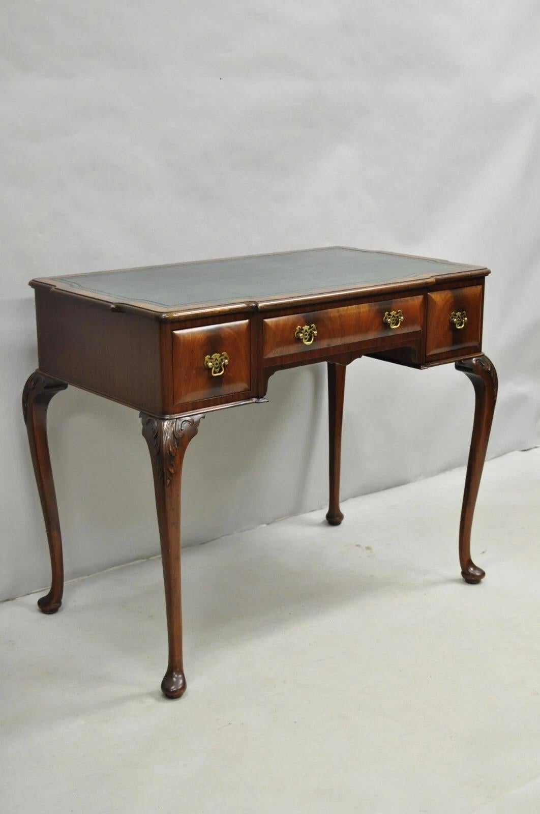 Please message us with your zip code to request a more reasonable domestic U.S. shipping quote.

Antique English Georgian Crotch Mahogany Green Leather Top Small Writing Desk. Item features 3 hand dovetailed drawers, green tooled leather top,
