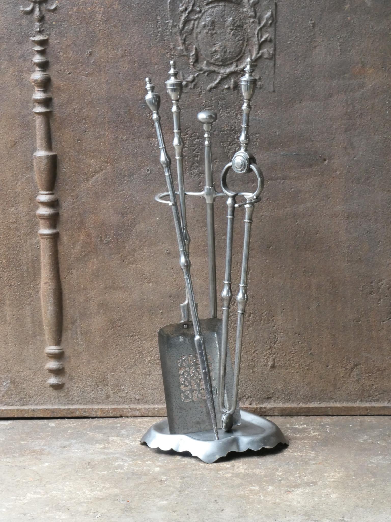 18th - 19th century English Georgian period fireplace toolset. It is made of polished steel. The toolset consists of three fire irons and a stand. The condition is good.













 