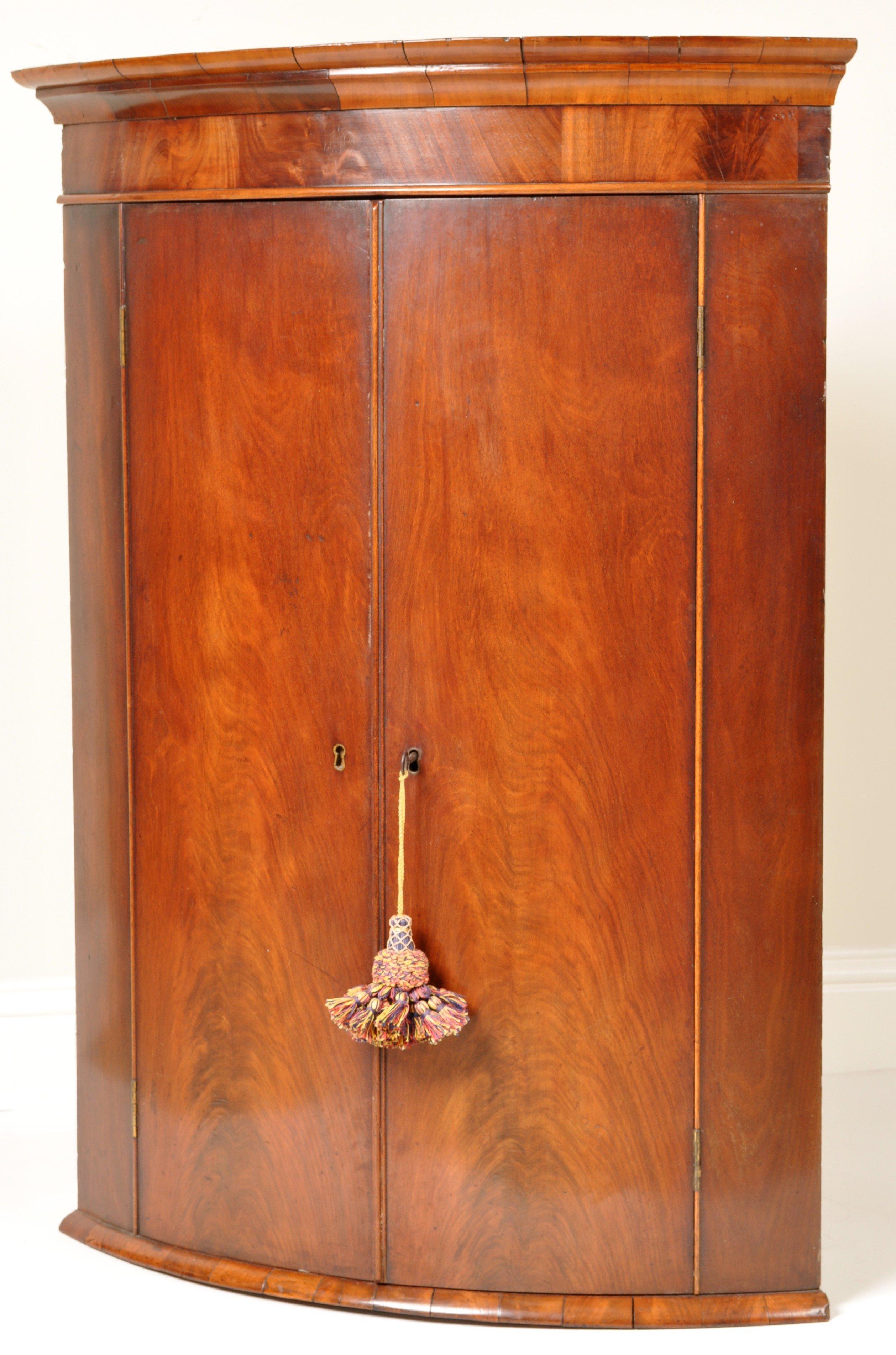 Late 18th Century Antique English Georgian Flame Mahogany Bow-Fronted Corner Cabinet, circa 1780