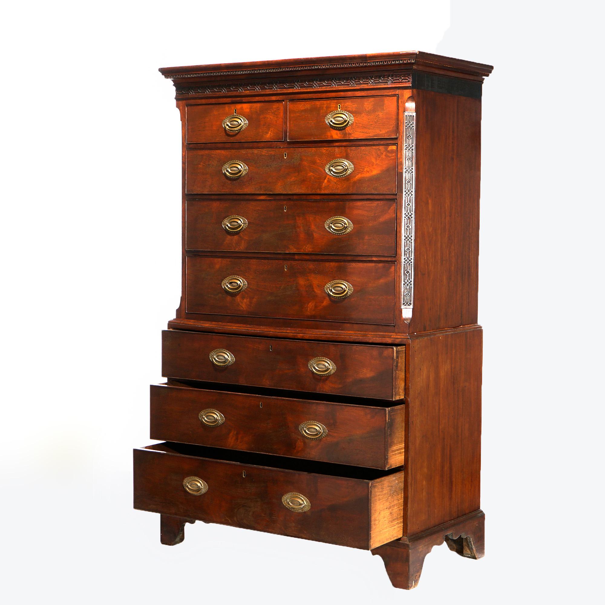 An antique English Georgian chest on chest offers flame mahogany construction with upper having two small drawers over three long drawers surmounting lower having three long drawers raised on bracket feet, c1820

Measures- 75'' H x 44'' W x 23'' D.