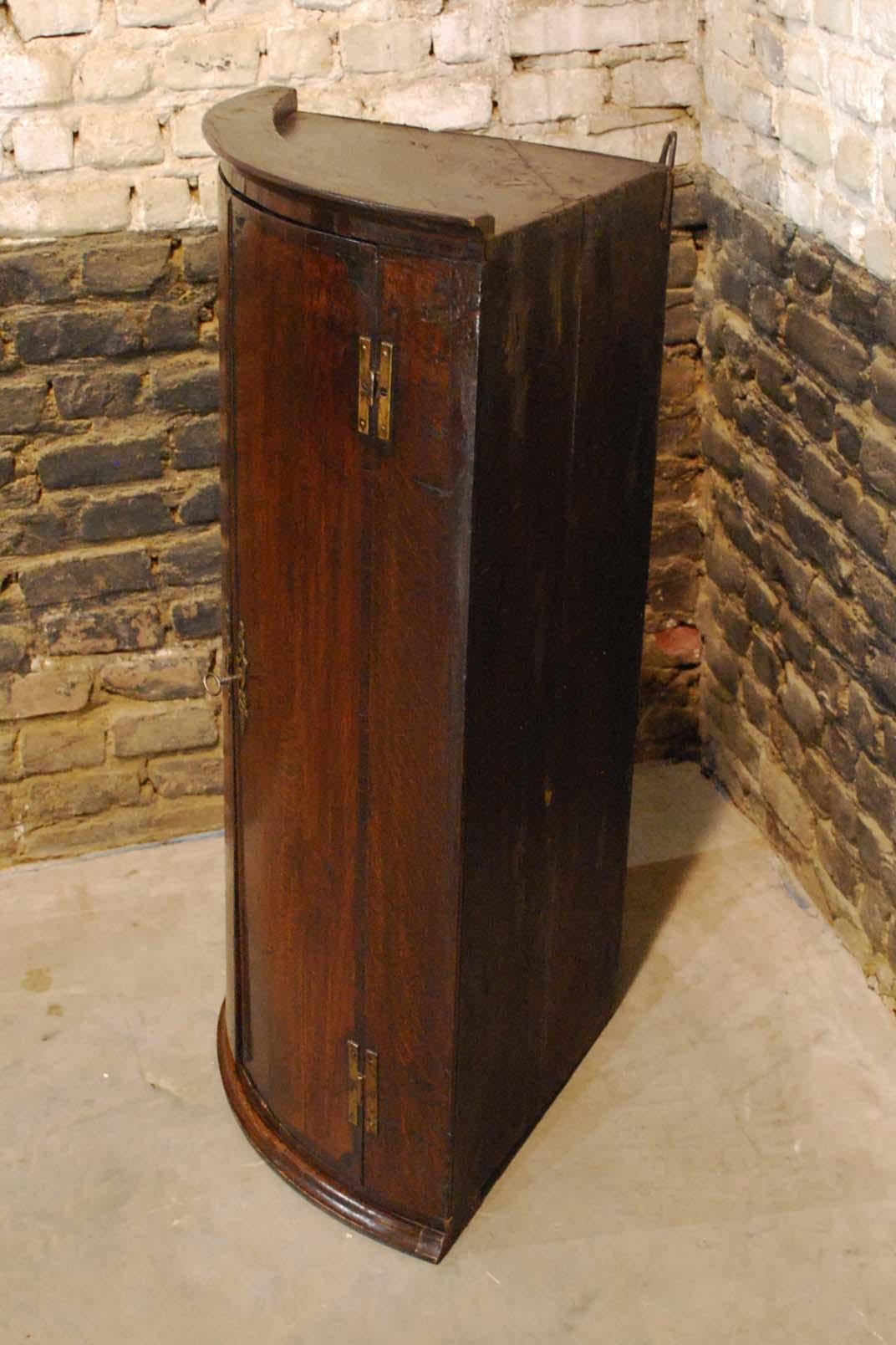 British Antique English Georgian Oak Hanging Bowfront Corner Cabinet For Sale