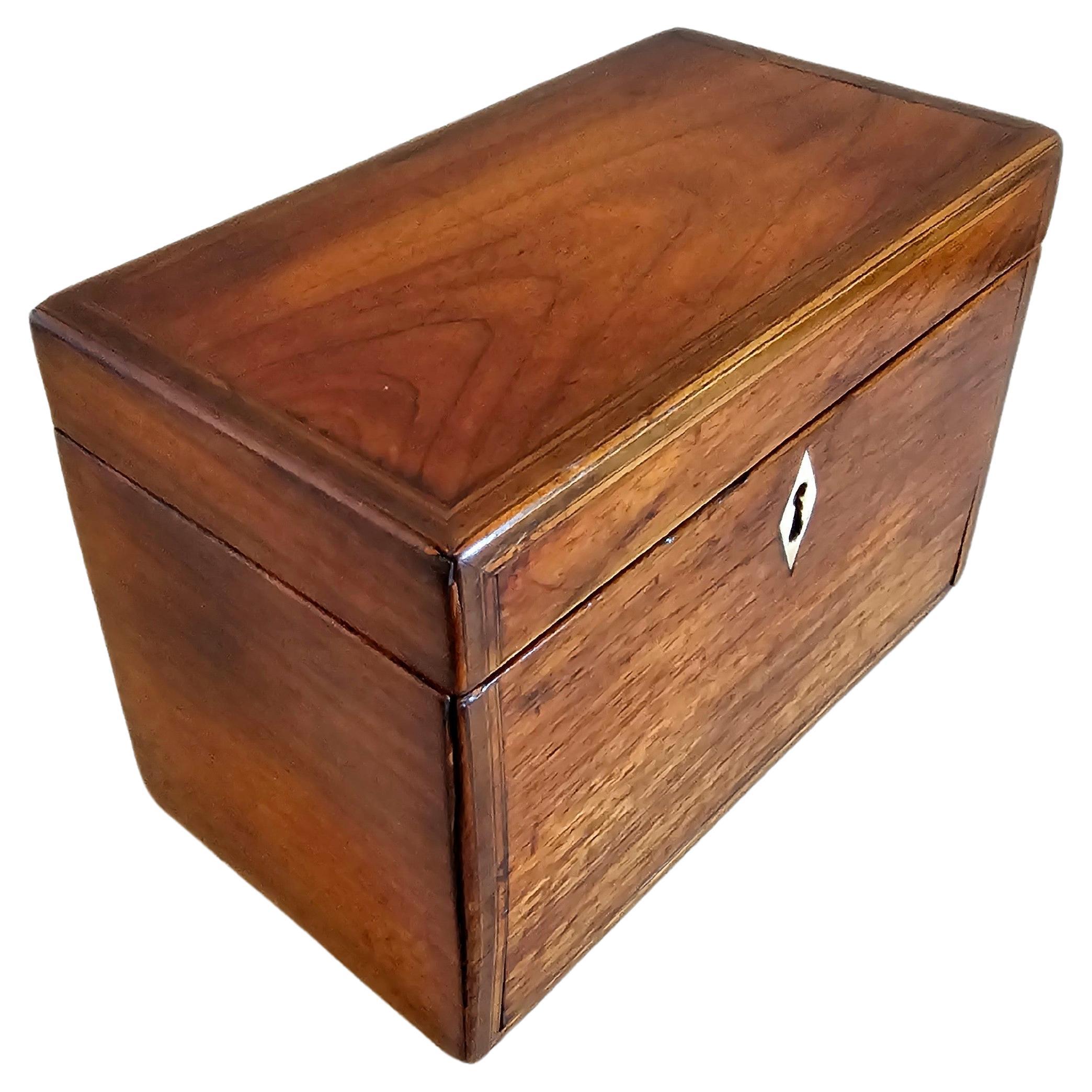 A charming period English George III (1760-1820) mahogany inlaid tea caddy. 

Tea was of exceptional value prior to the mid-19th century, plus the type of tea you could afford and the vessel you chose to store it in were seen as a great symbol of