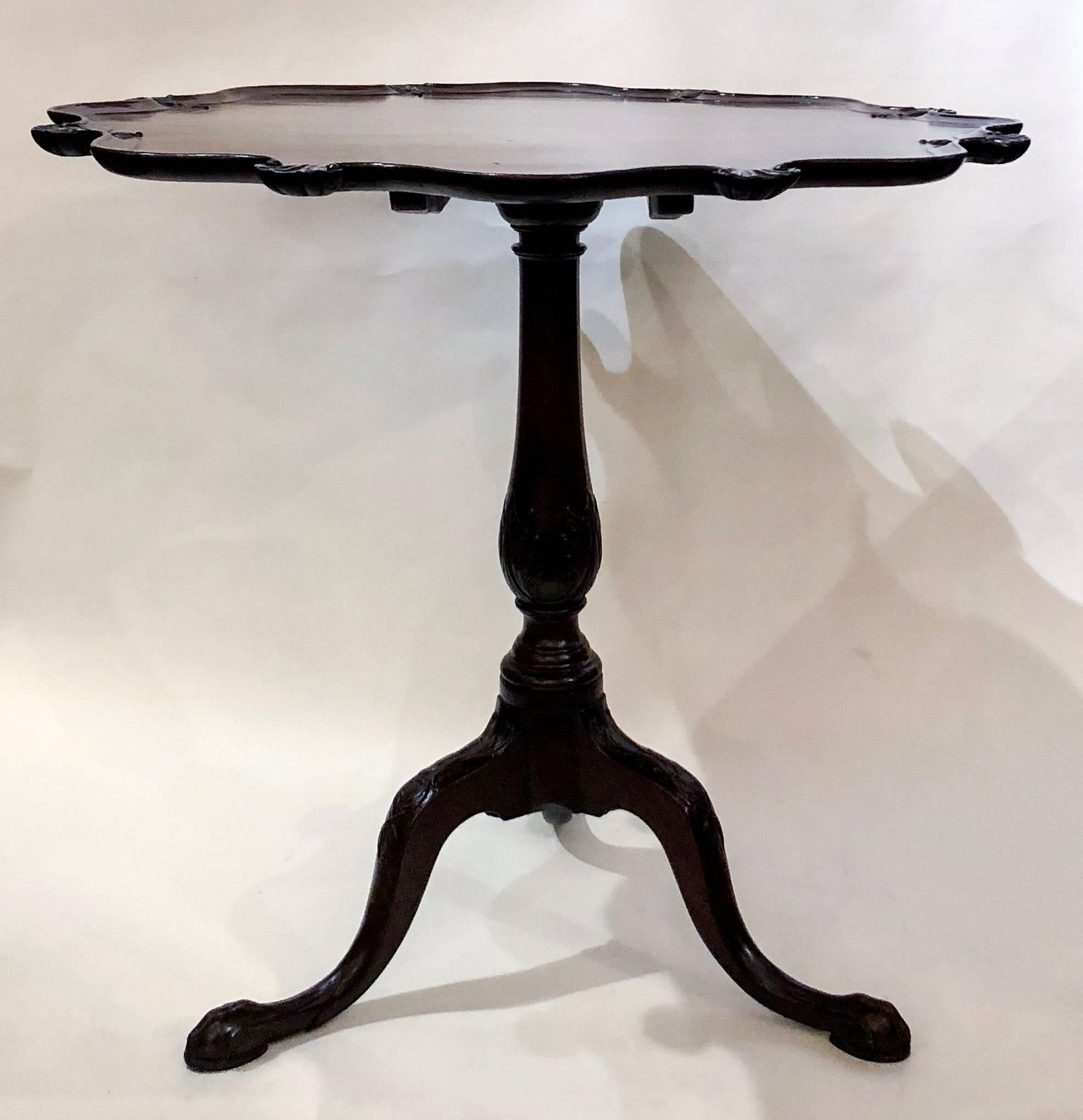 This is a handsome old pie-crust tilt table. When tilted, it stands 46 inches high.