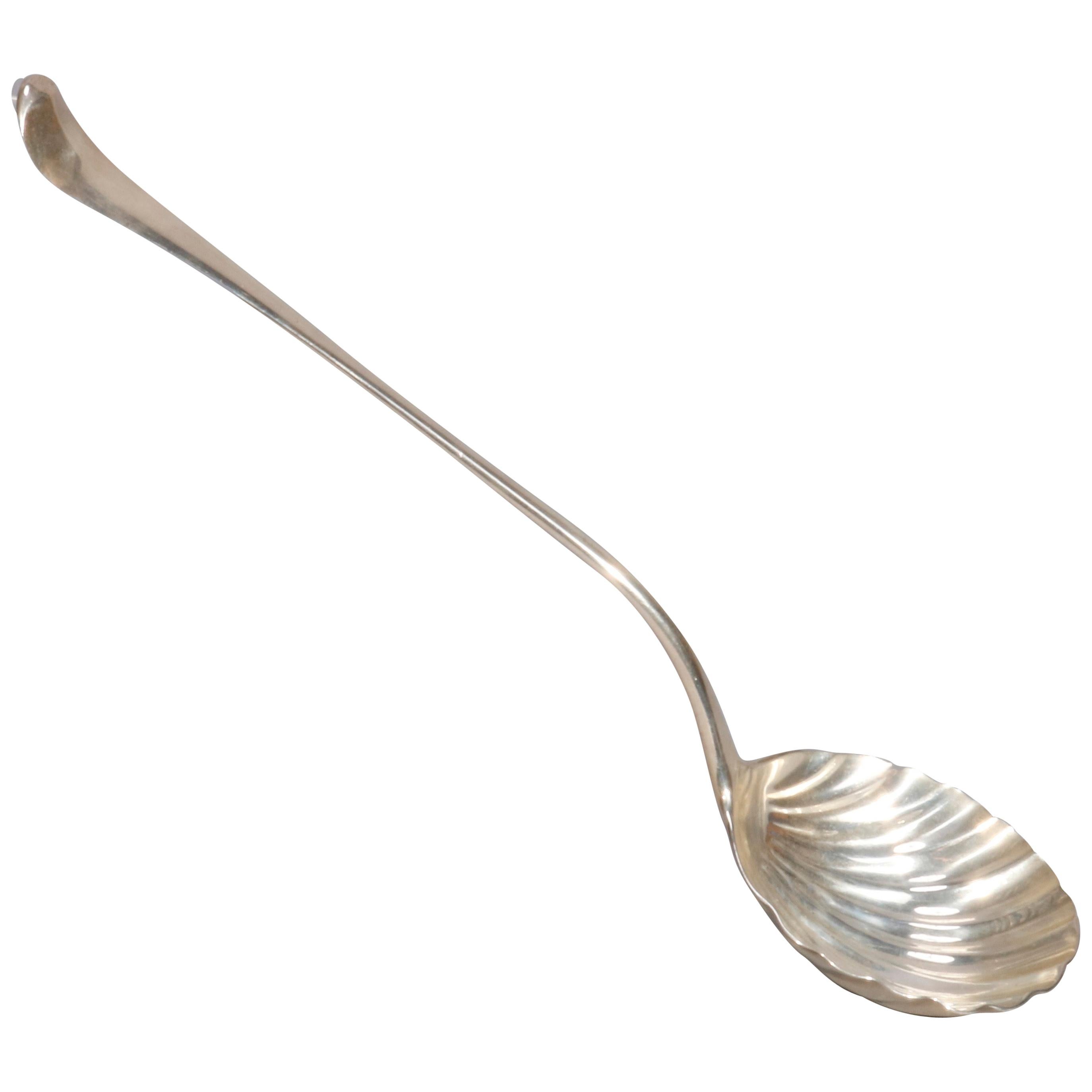 An antique English Georgian ladle offers sterling silver construction with shell form bowl, en verso hallmarks as photographed, 6.7 toz, circa 1850

Measures- 9.25