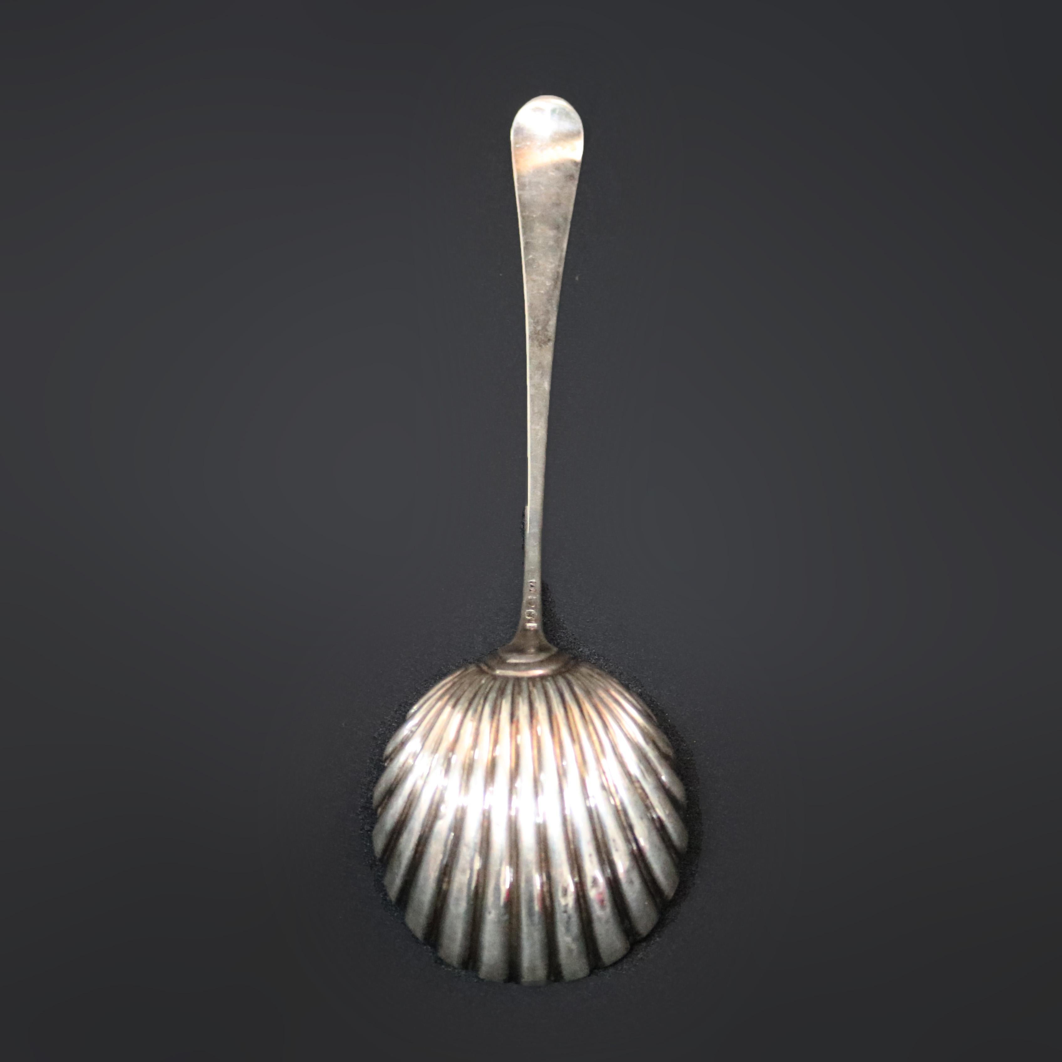 An antique English Georgian sterling silver shell ladle with monogrammed handle, 5.5 T.O., hallmark stamped en verso as photographed, circa 1930

Measures: 13.5