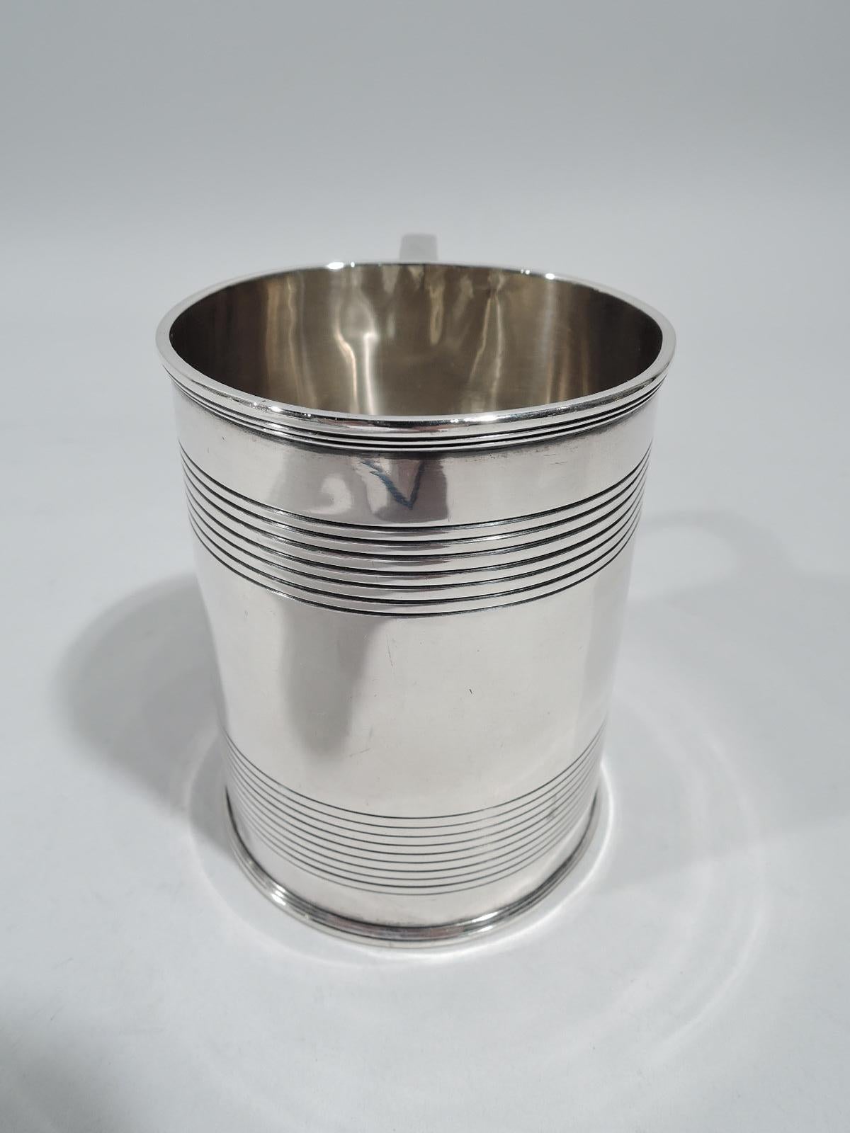 George III sterling silver baby cup. Made by Rebecca Emes & Edward Barnard in London in 1814. Straight and gently upward tapering sides and double-scroll handle. Reeded bands that leave plenty of room for engraving. Fully marked. Weight: 4.3 troy