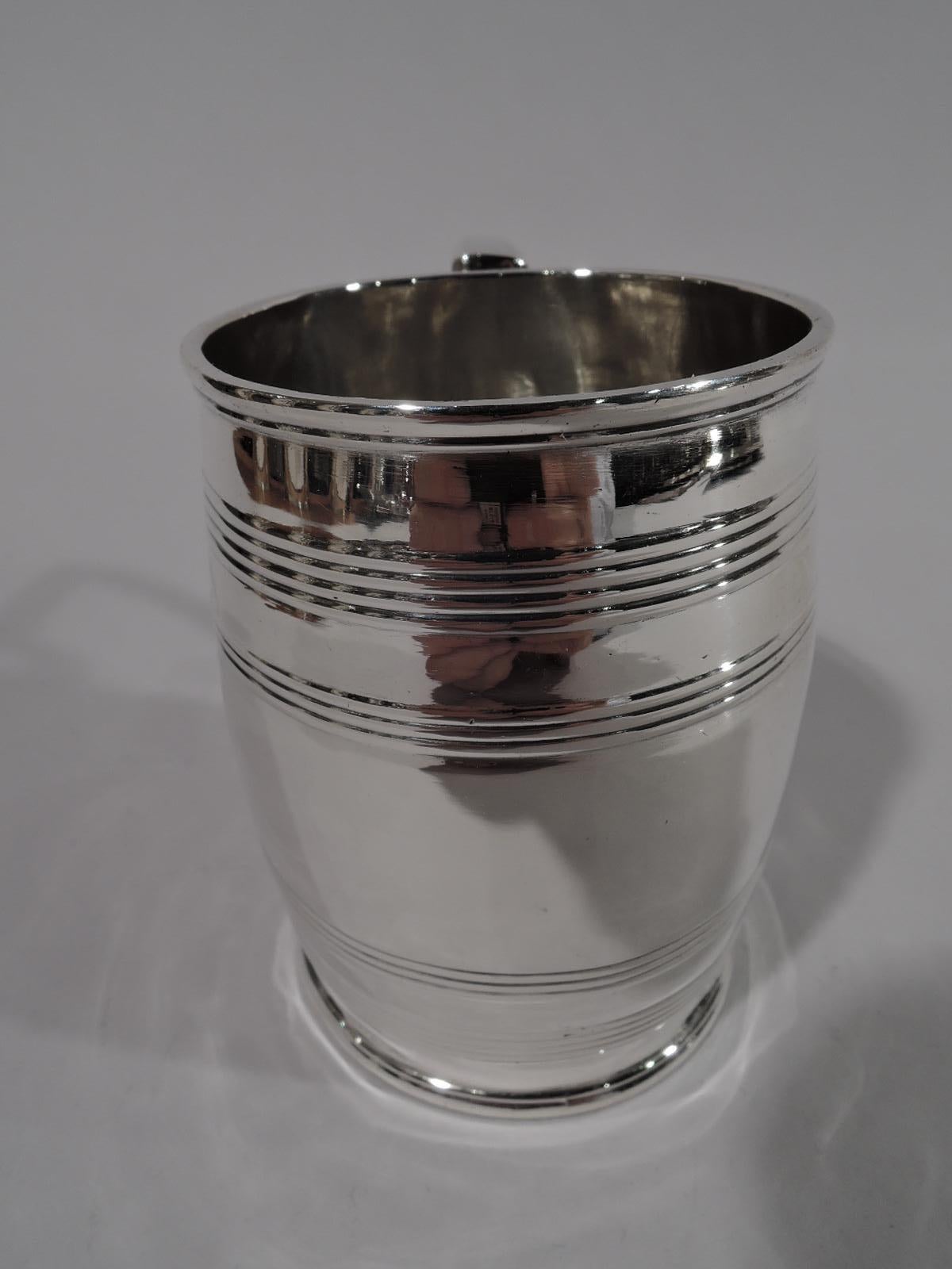 George III sterling silver christening mug. Made by Robert & Samuel Hennell in London in 1803. Barrel body with reeded hoops and scroll bracket handle. A great baby gift that anticipates grownup enjoyment. Fully marked. Weight: 3.5 troy ounces.