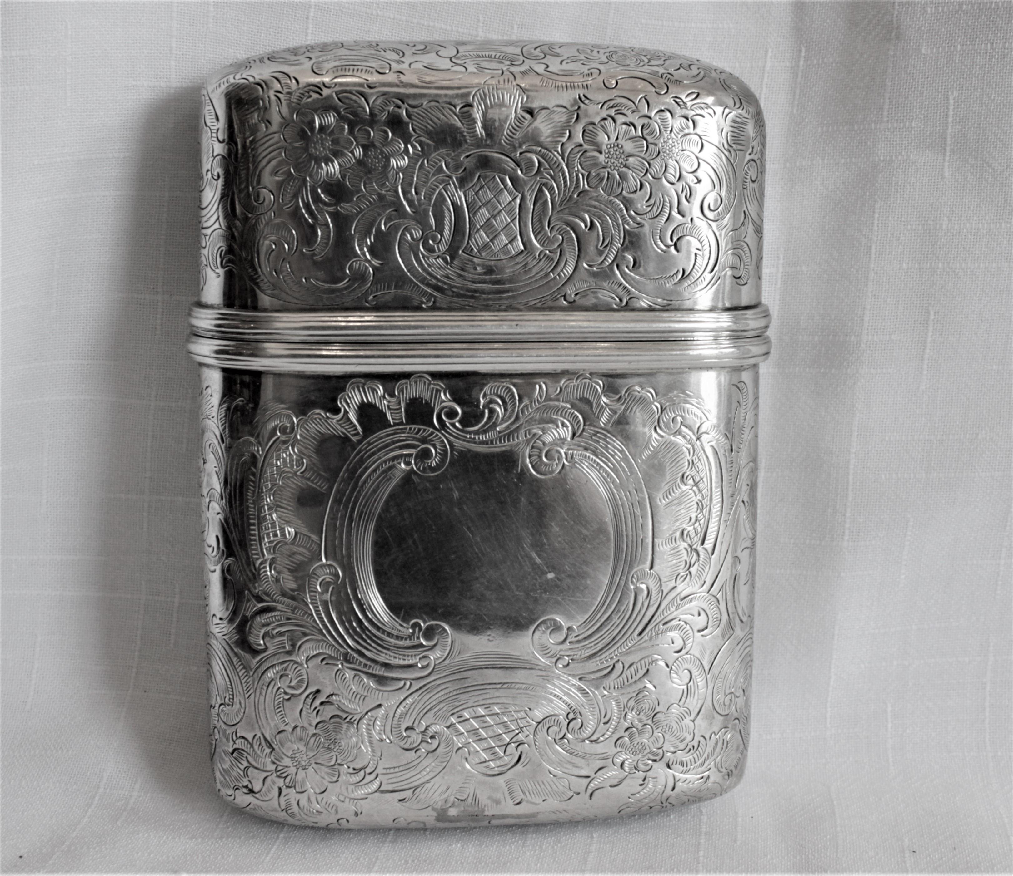 This sterling silver and intricately engraved cigar case was made in London England in circa 1831, during the reign of King George IV. The top and bottom are both ornately engraved with a scrolling leaf decoration and each is hallmarked. The top