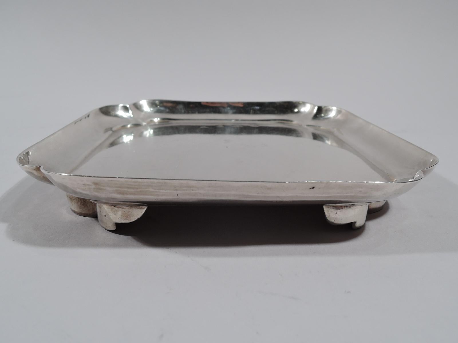 George I sterling silver salver. Square with lobed corners and same corner supports. Beautiful early Georgian. Fully marked; maker’s mark worn. Weight: 6.4 troy ounces.