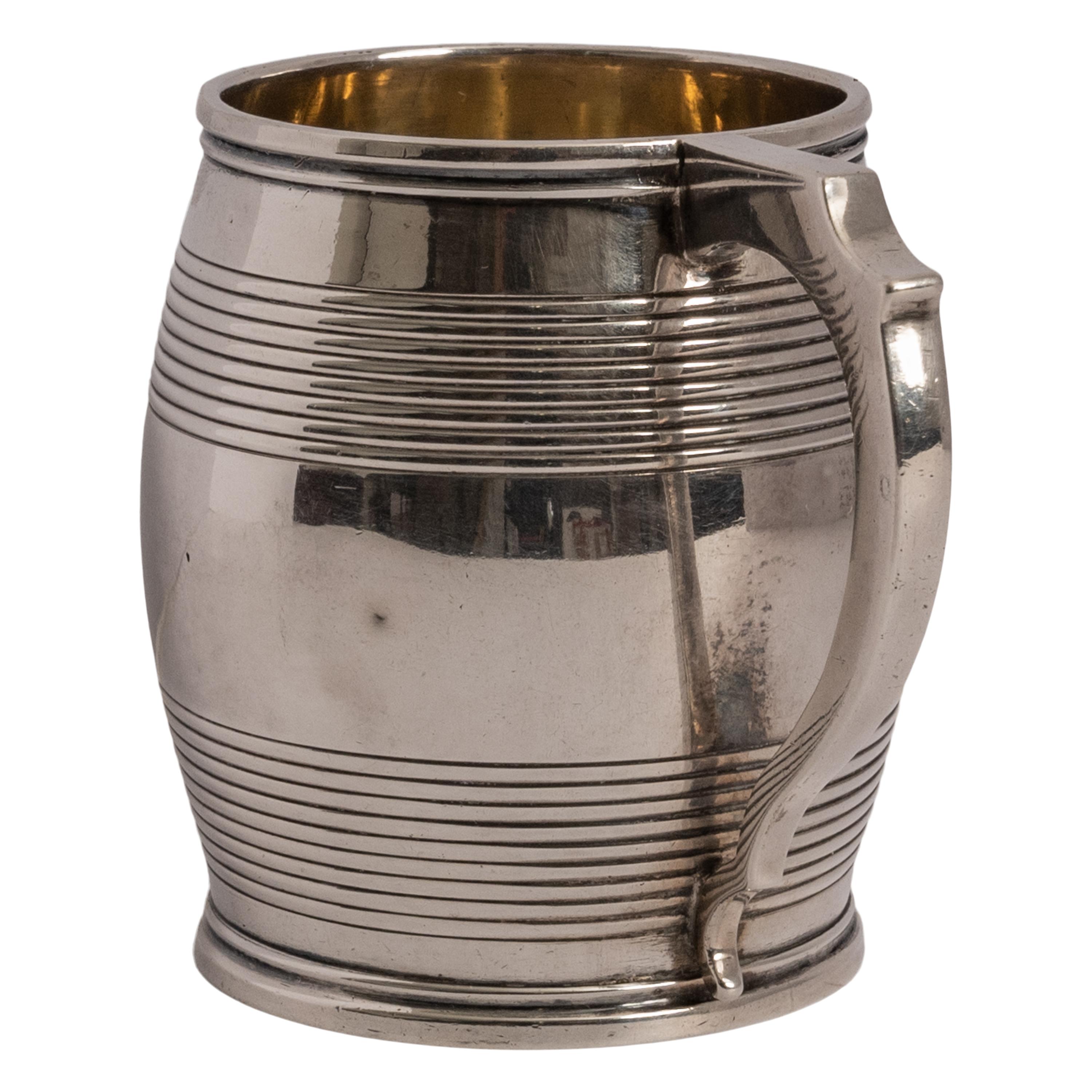 A good antique Georgian sterling silver & silver gilt christening cup/mug, William Bateman I, London, 1825.
The handled cup having a tankard shape and concentric ribbing to the top and base, the mug having a shaped handle and a silver gilt