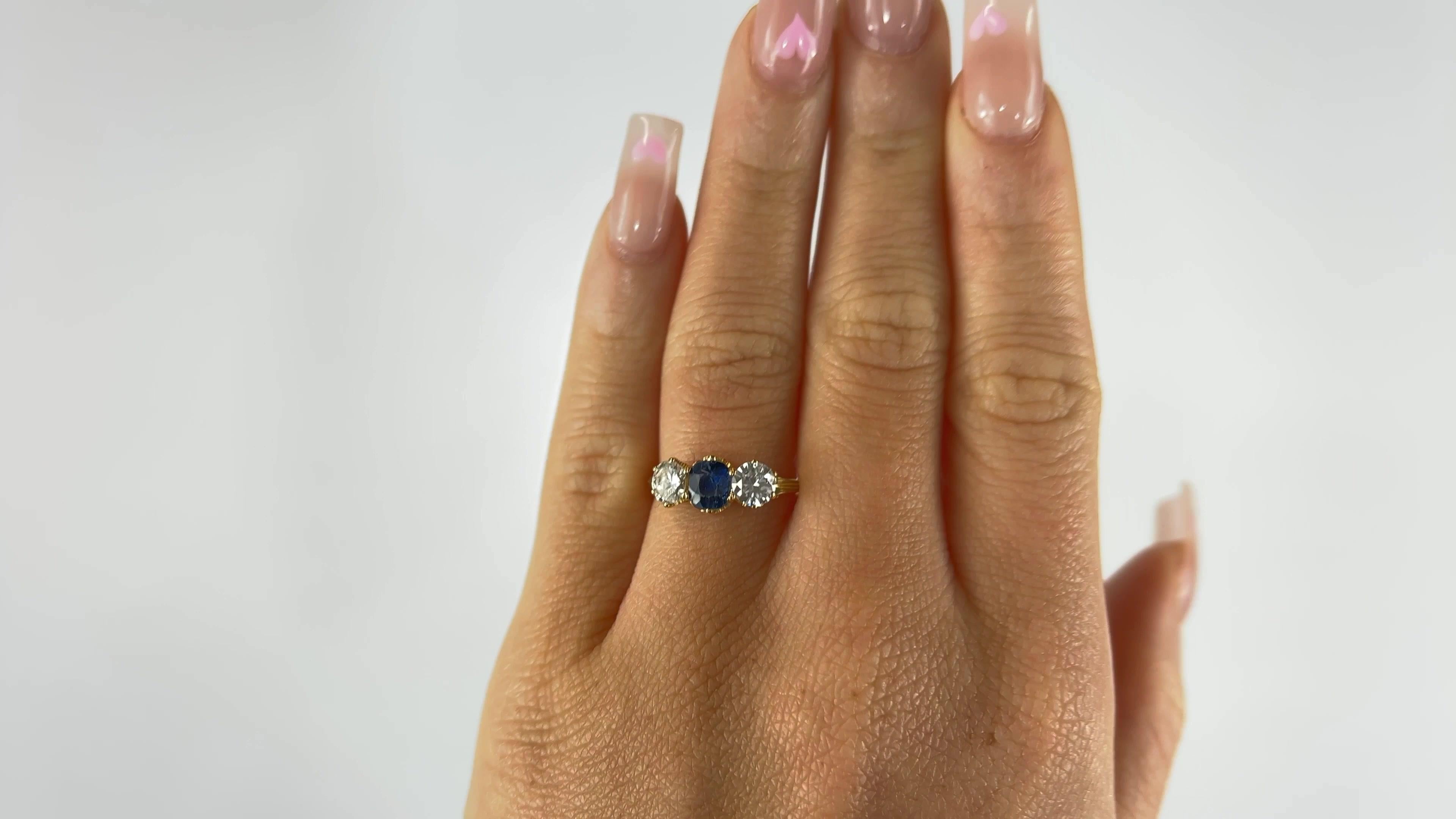 One Antique English GIA Sapphire Diamond 18 Karat Gold Three Stone Ring. Featuring GIA certified one oval shaped sapphire of approximately 1.30 carats accompanied with certificate #6224278350 stating the sapphire is of Australian origin and has not