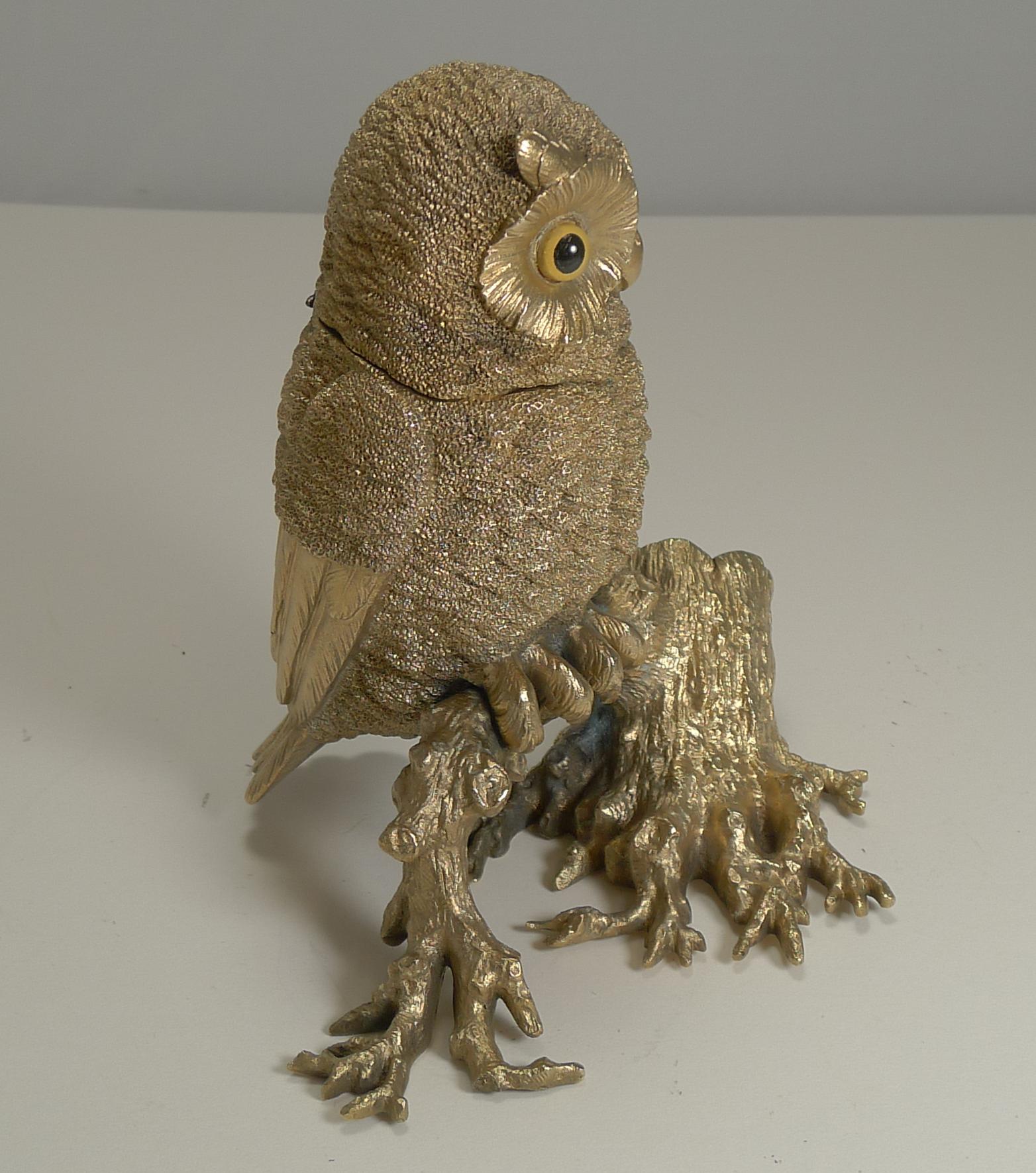 A top quality antique figural inkwell cast from bronze with exquisite detail and smothered in gold, professionally cleaned to create a show-stopping desk-top heirloom.

The owl with his two glass eyes sits on a tree branch leading to a hollowed