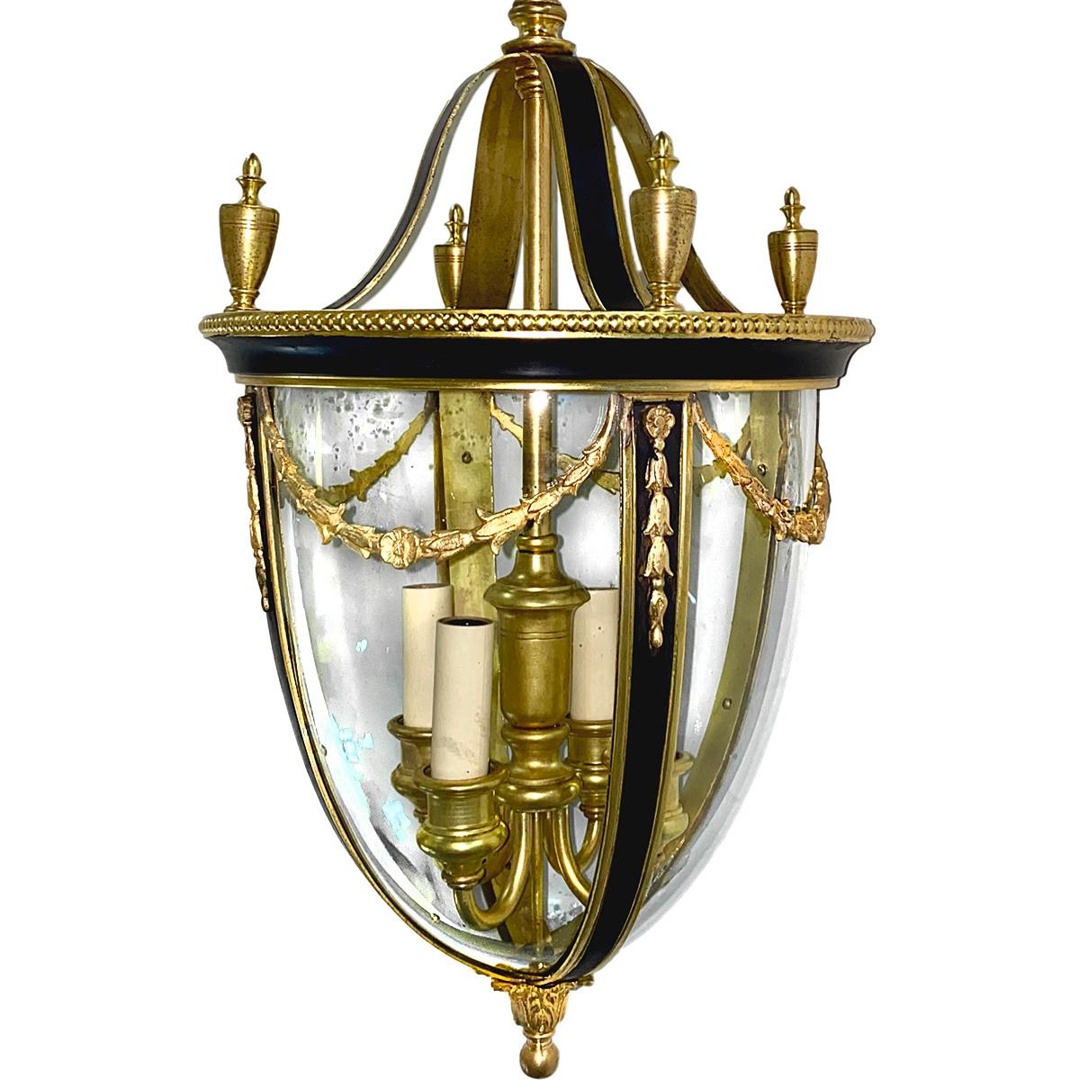 A circa 1920's gilt bronze lantern with painted details.

Measurements:
Drop (adjustable): 29