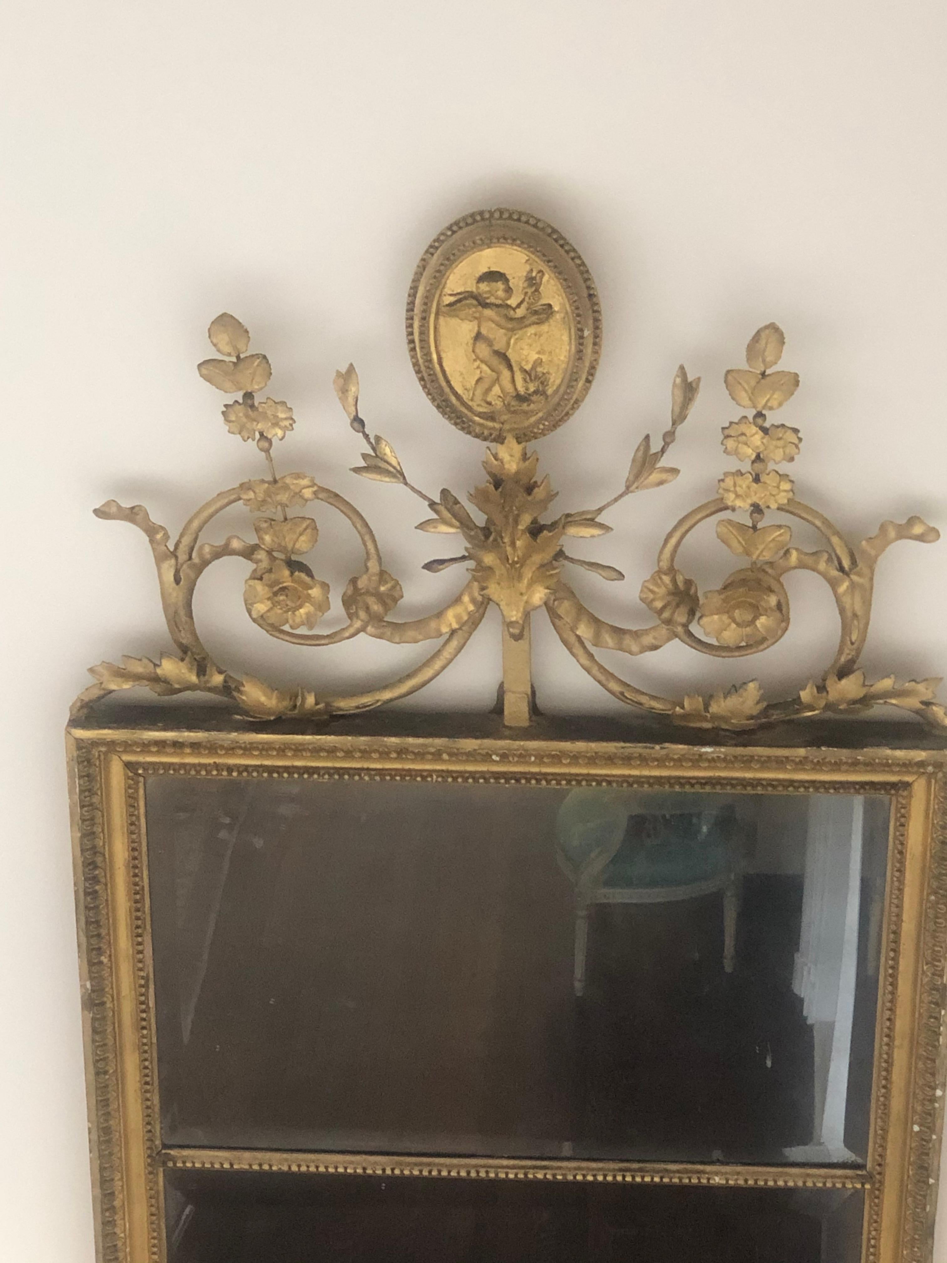 Antique English giltwood pier mirror with tole top in the manner of Robert Adam.