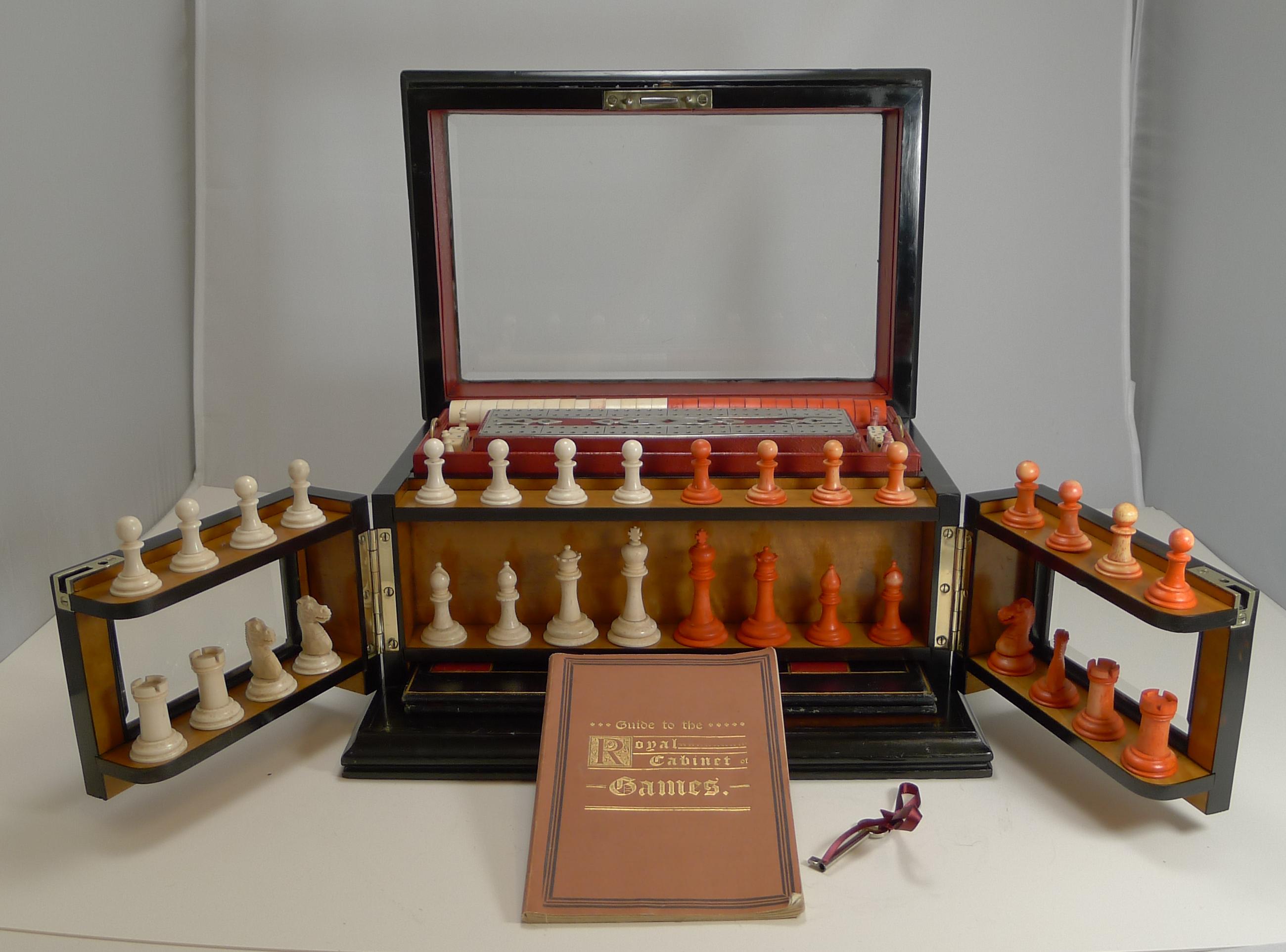 An exceptional glazed Coromandel games box, my favourite kind retaining the original bevelled glass panels to the top and front. The box retains both the original engraved inlaid brass plaque and the original instruction book 