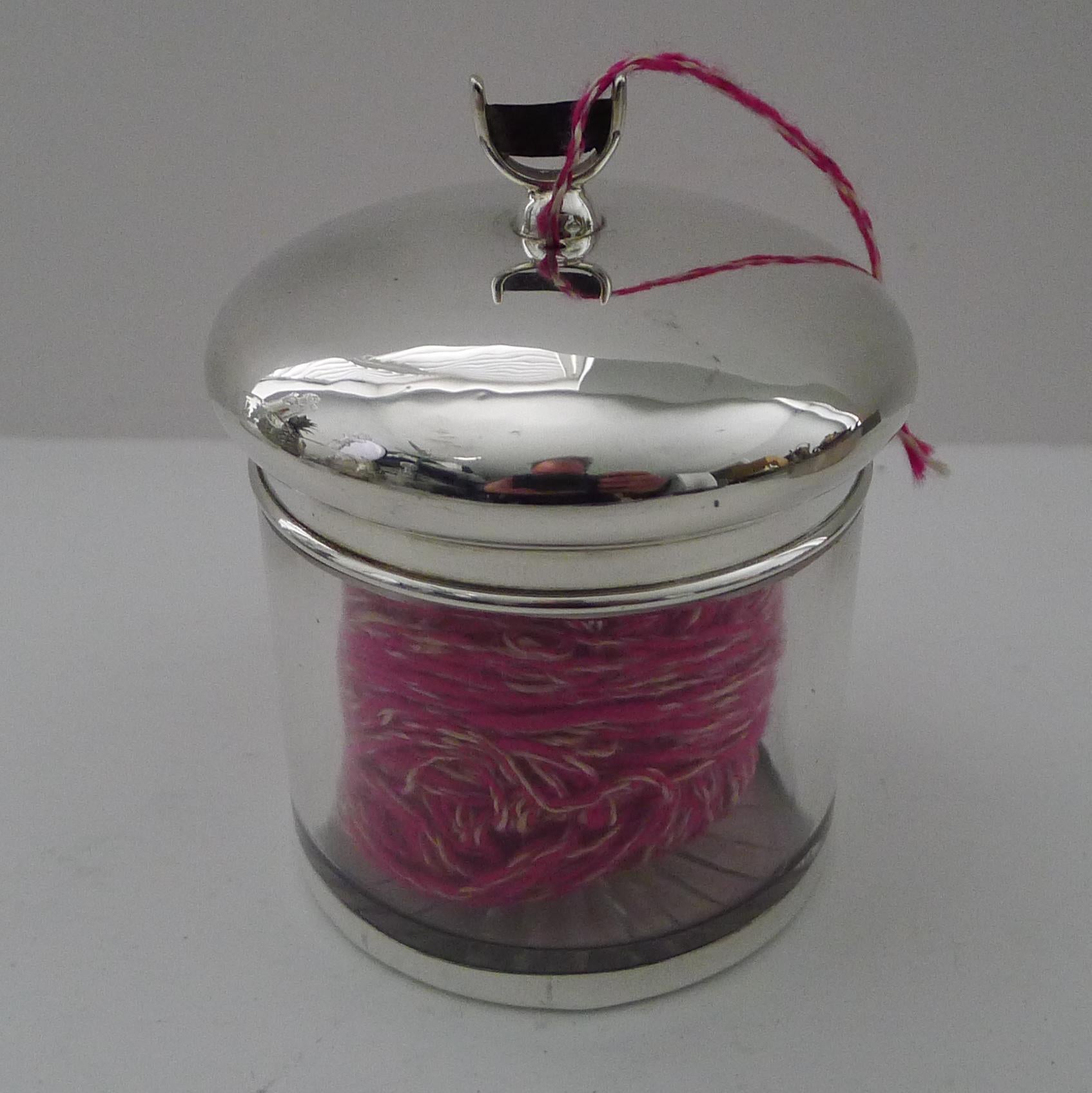 A most unusual late Victorian fine string or twine box made from glass with a star cut base, the base mounted with a sterling silver foot and fitted with a solid silver lid topped with a cutter.

The lid is fully hallmarked for the highly