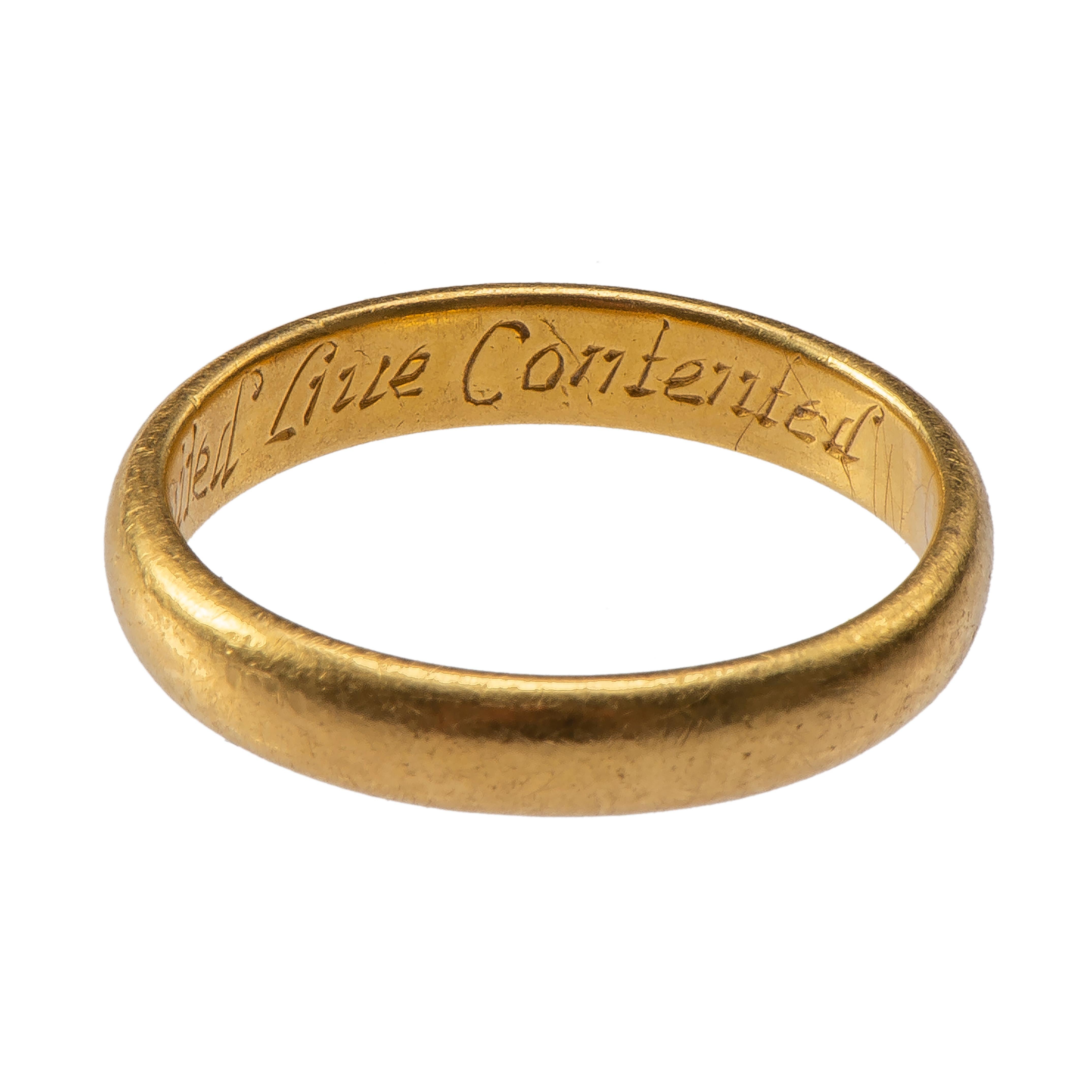 Posy ring “Hearts United Live Contented” 
England, 17th century 
Gold 
Weight 6.9 gr.: circumference 63.46 mm.: US size 10 1/2; UK size U ½ 

A plain gold band with D-section and engraved inscription on the interior in cursive script reads: “Hearts