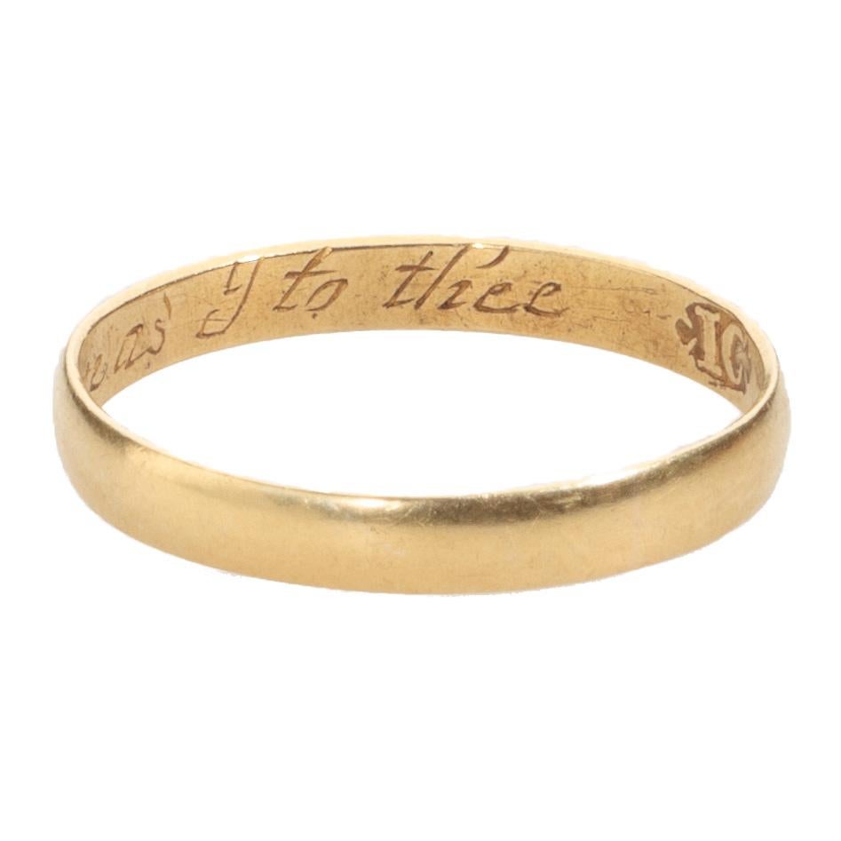 POSY RING “BE TRUE TO ME AS I TO THEE”
England, 17th century
Gold
Weight: 1.9 gr.; circumference: 57.6 mm.; size: US 8.25, UK Q

Fine D-sectioned hoop. Engraved on the interior in italics: “Be true to me as I to thee” followed by the maker’s mark IC