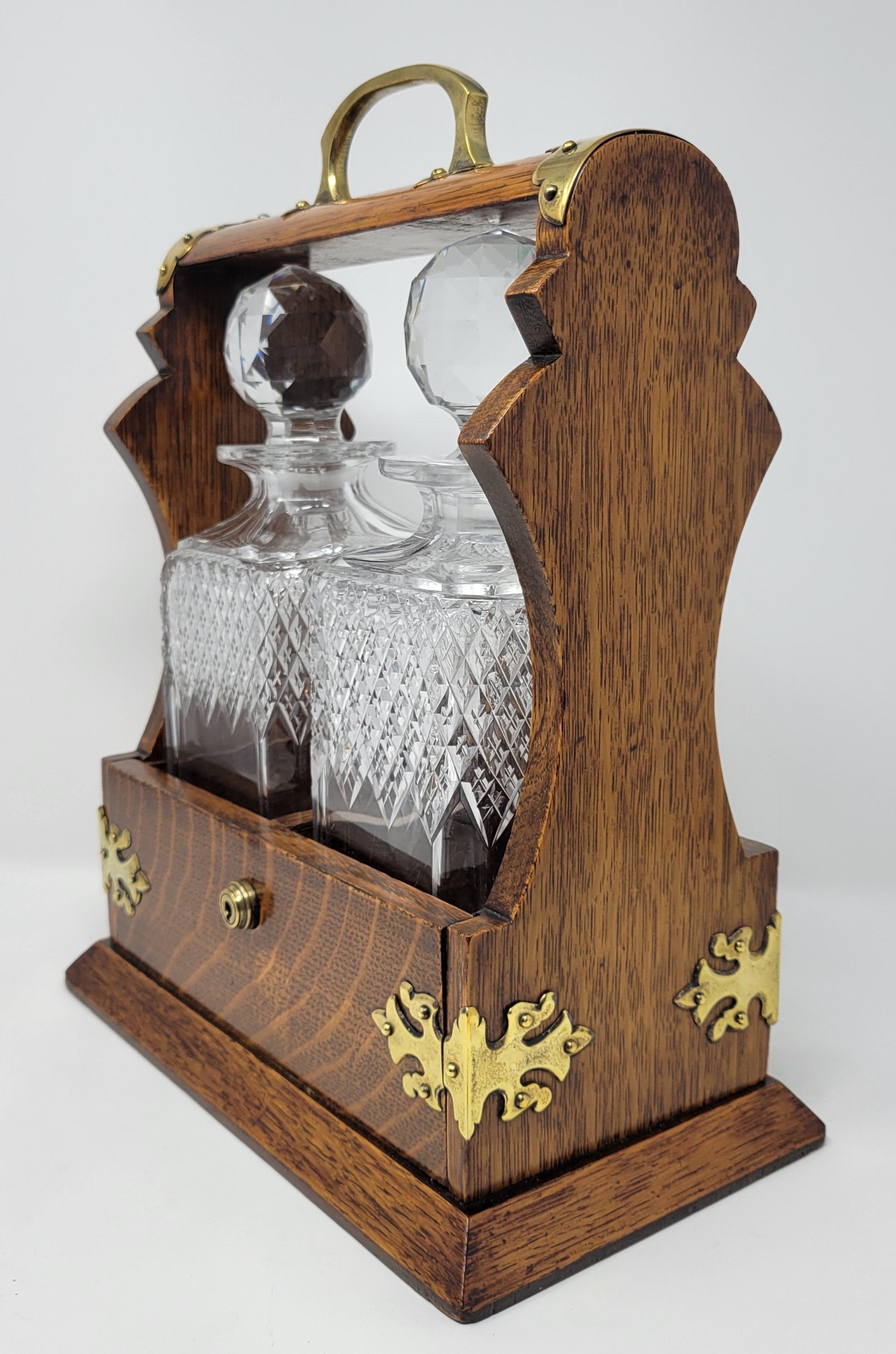 Antique English Golden Oak Two Bottle Tantalus In Good Condition For Sale In New Orleans, LA