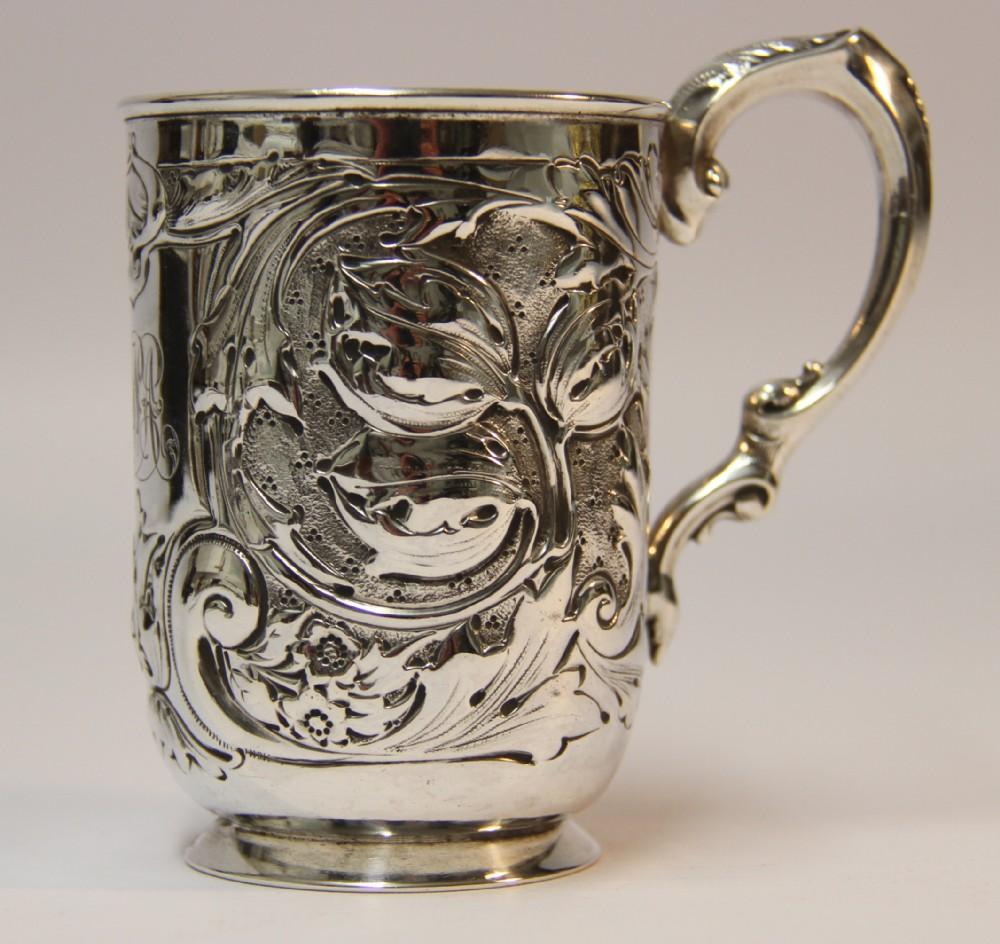 This high quality hall marked silver tankard was made in Sheffield 1901/2.
It has good proportions and weight and has bold raised and engraved floral and foliate decoration to both the body and the handle. Monogrammed and in good condition.
 