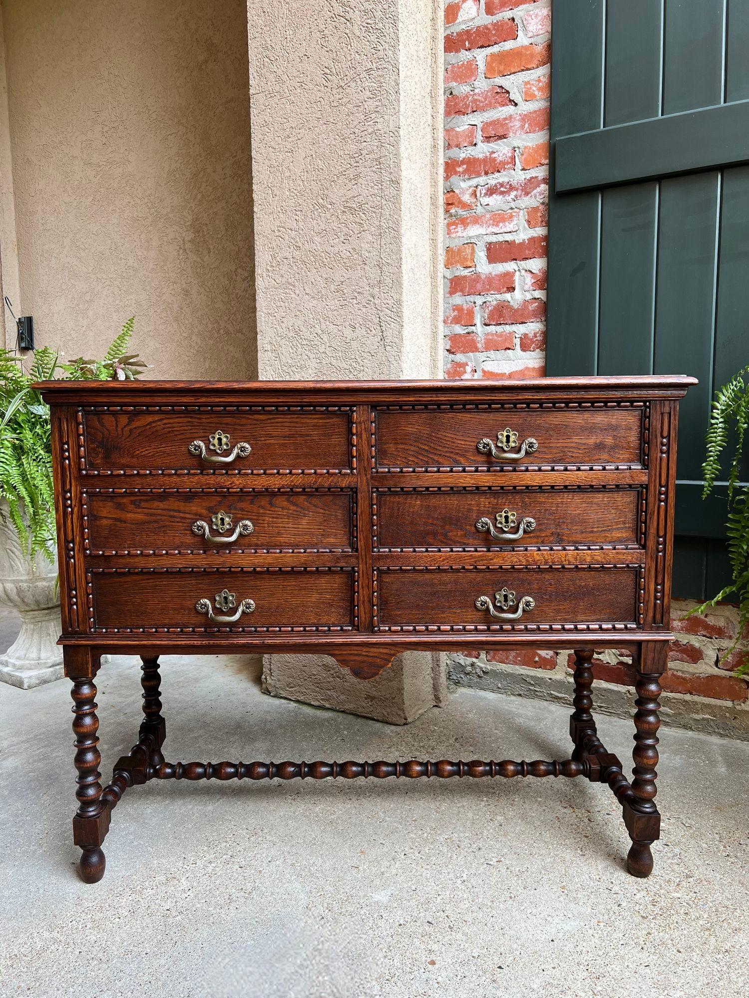 Antique English Hall Table Chest Sideboard Cabinet Jacobean Carved Oak Bobbin.

Direct from England, a beautiful antique 6 drawer hall table in lovely Jacobean style!  Six large drawers, all having large beaded trim edges with heavy brass handles