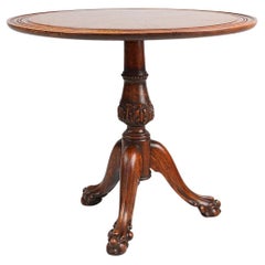 Antique English hand carved circular oak side table with lions head feet