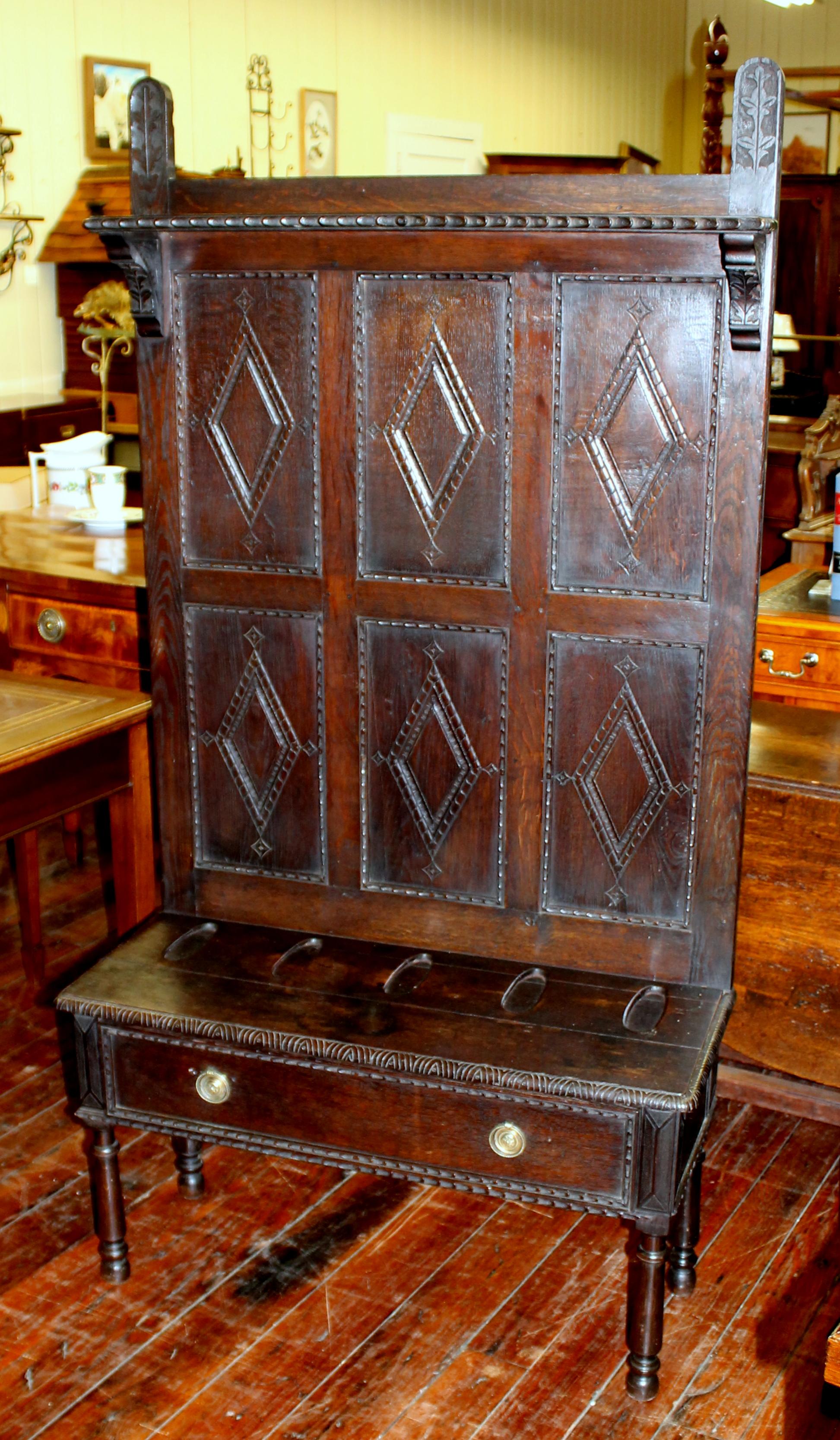 Very rare antique English hand carved oak Jacobean style gun rack and dettle with lower drawer.
Used as a 