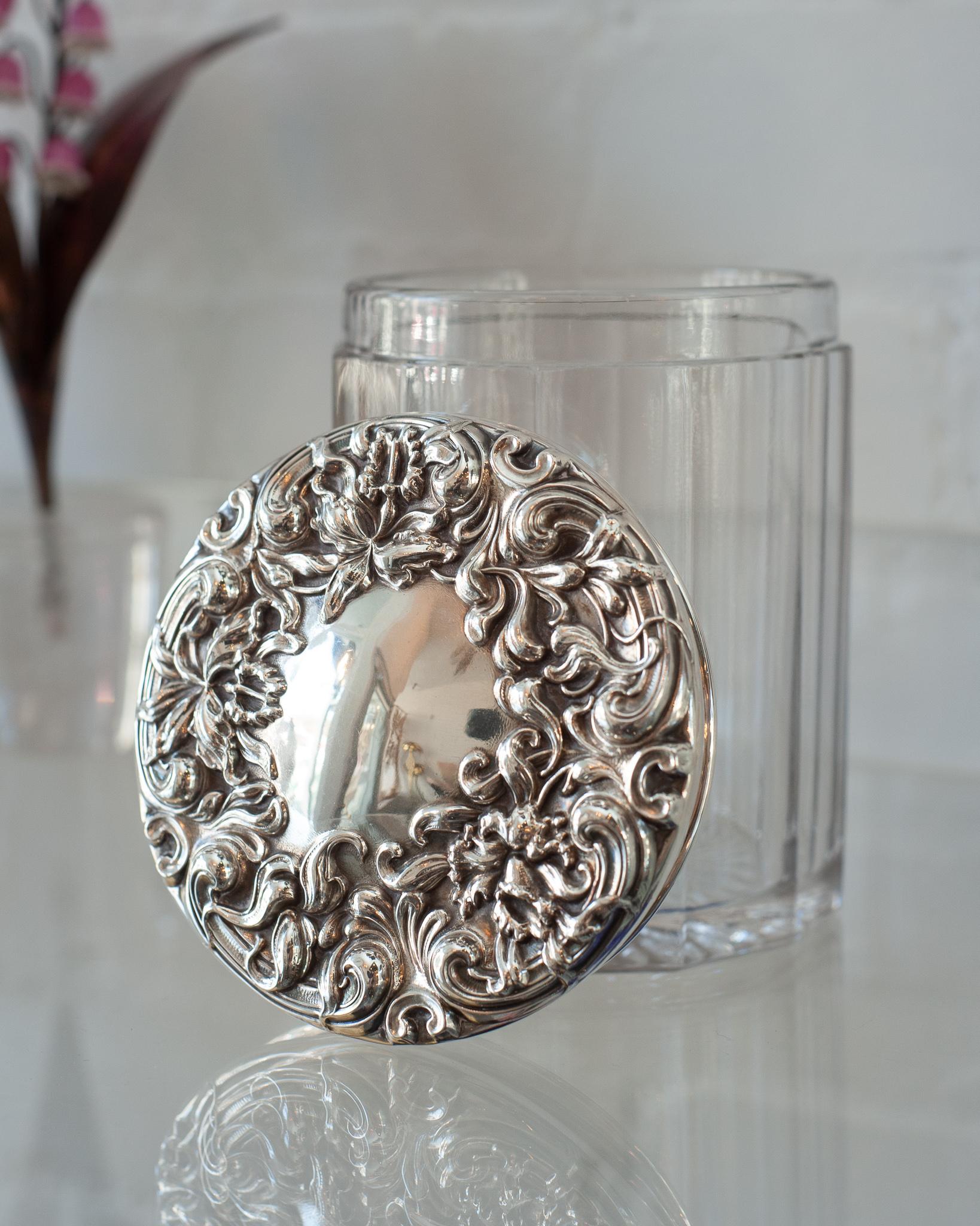 A stunning antique English crystal and hand chased sterling silver humidor. Originally used to house cigars this beautifulcontainer would be ideal for cookies, candies or nuts. Marked with Sterling & Fine Silver stamp.