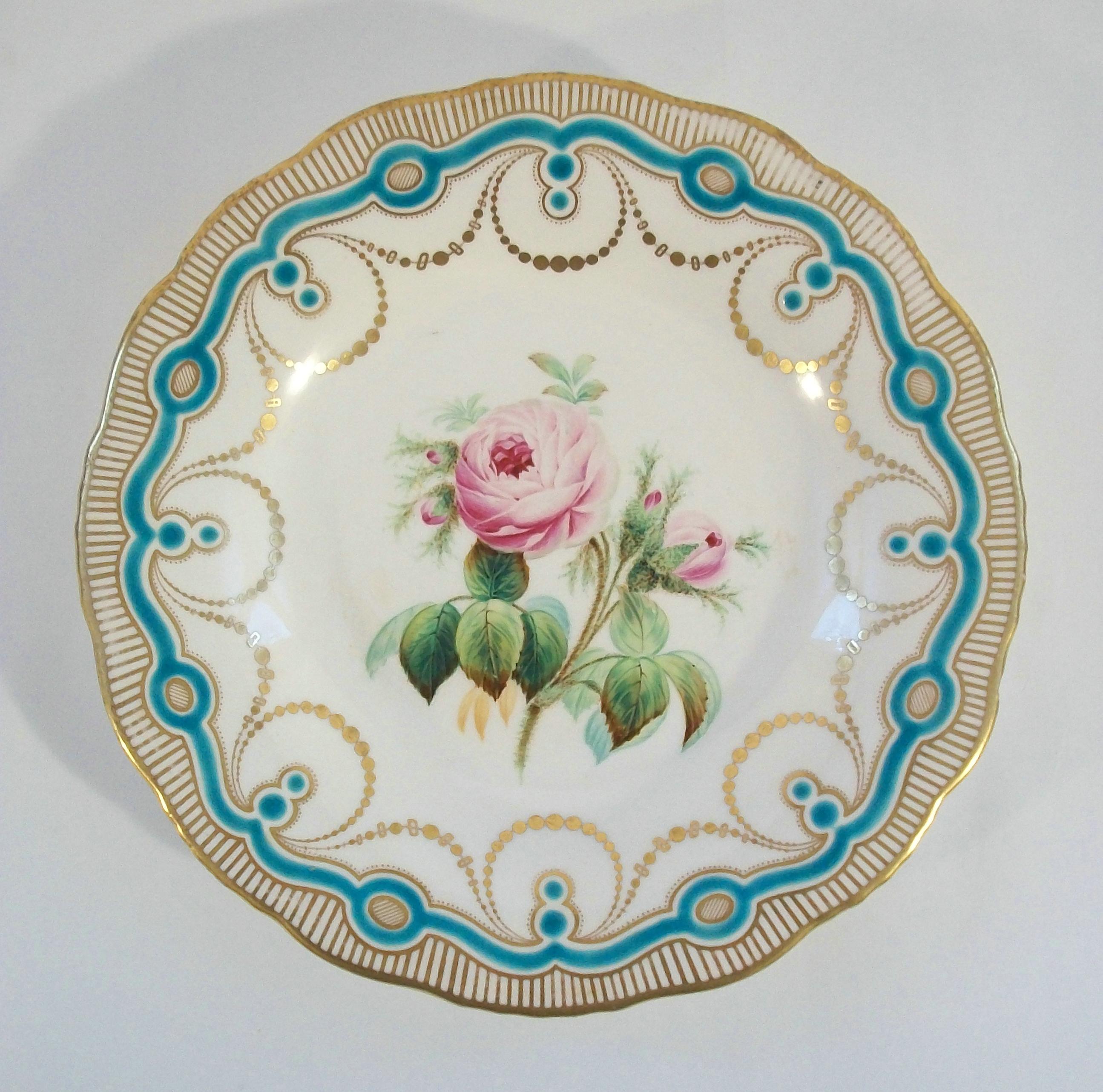 Antique English botanical ceramic cabinet plate - featuring a hand painted rose to the center and raised turquoise glaze pattern and gilding to the border - unsigned - United Kingdom - circa 1850's.

Excellent antique condition - rim chip to the