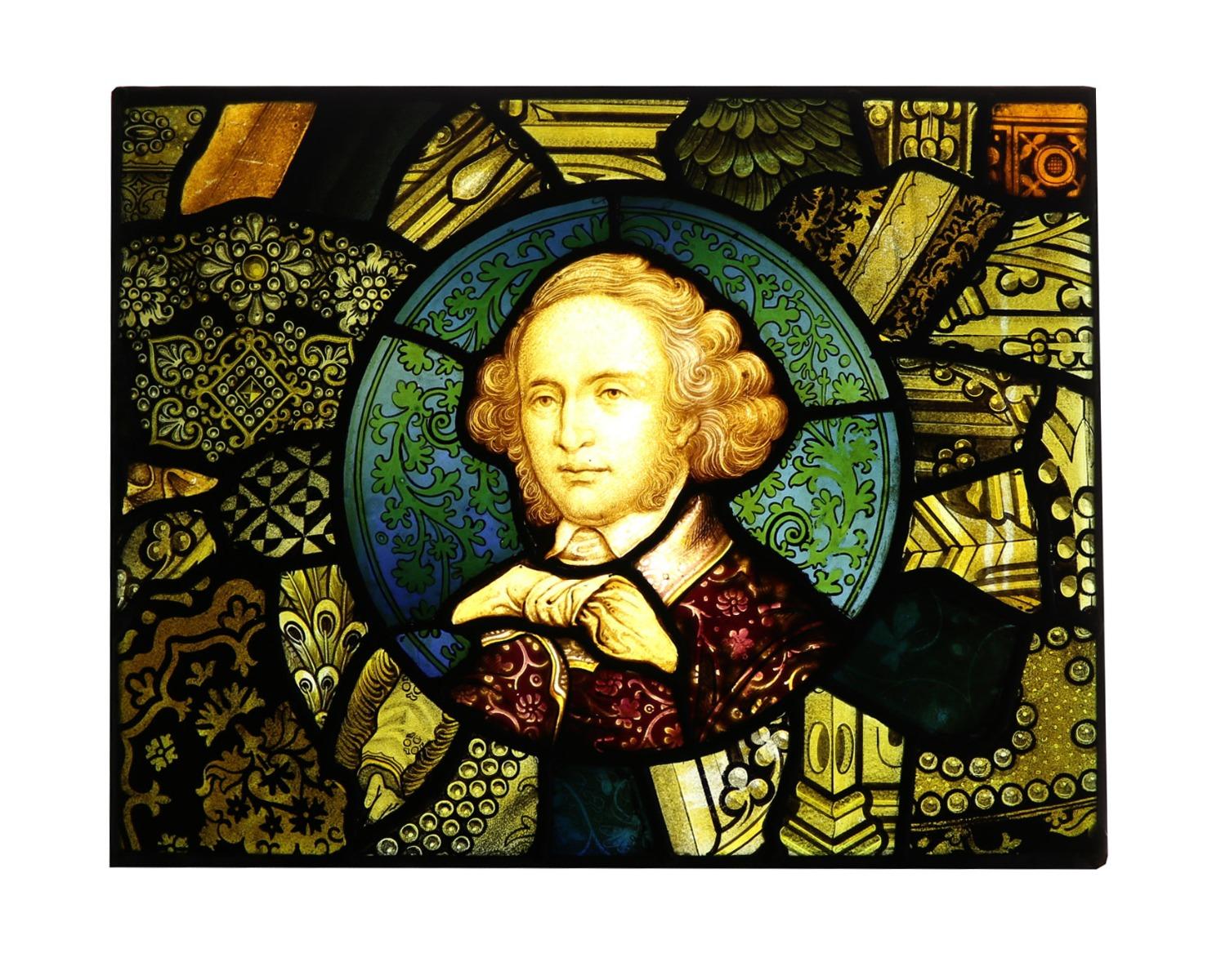 An antique stained glass window panel depicting the composer Felix Mendelssohn.