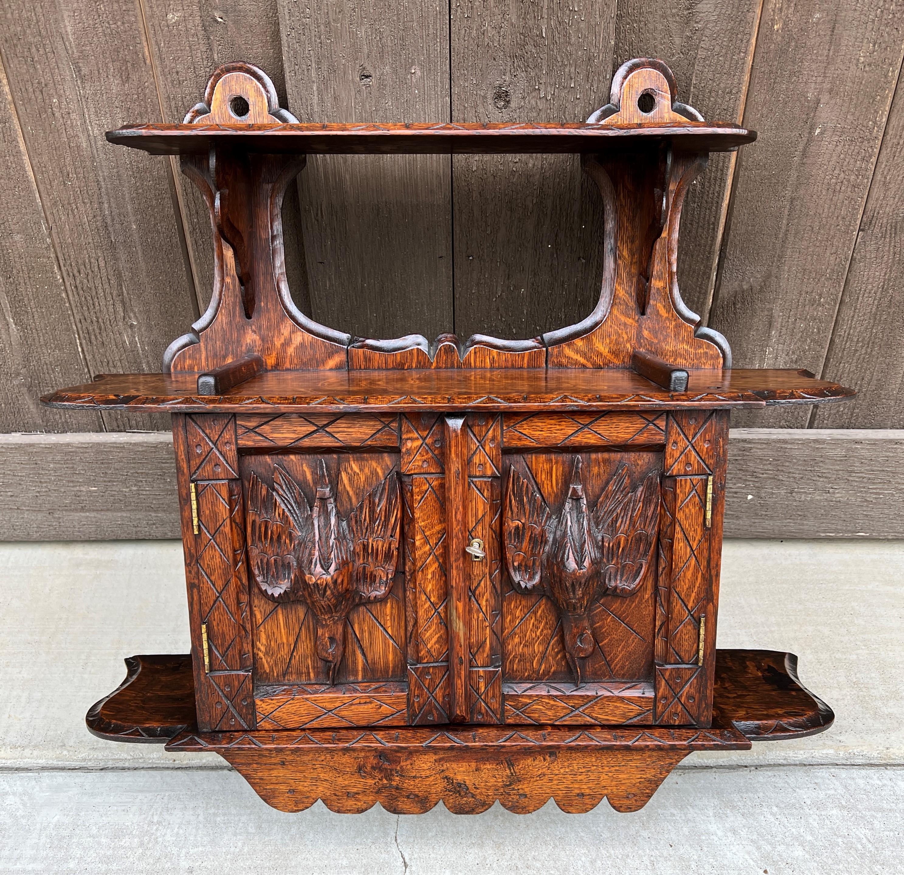 Charming antique English oak wall cabinet display shelf ~~highly carved bird accents ~~c. 1900

 Classic English hanging wall cabinet~~full of charm and character with carved birds on cabinet doors~~upper and lower shelves are perfect for