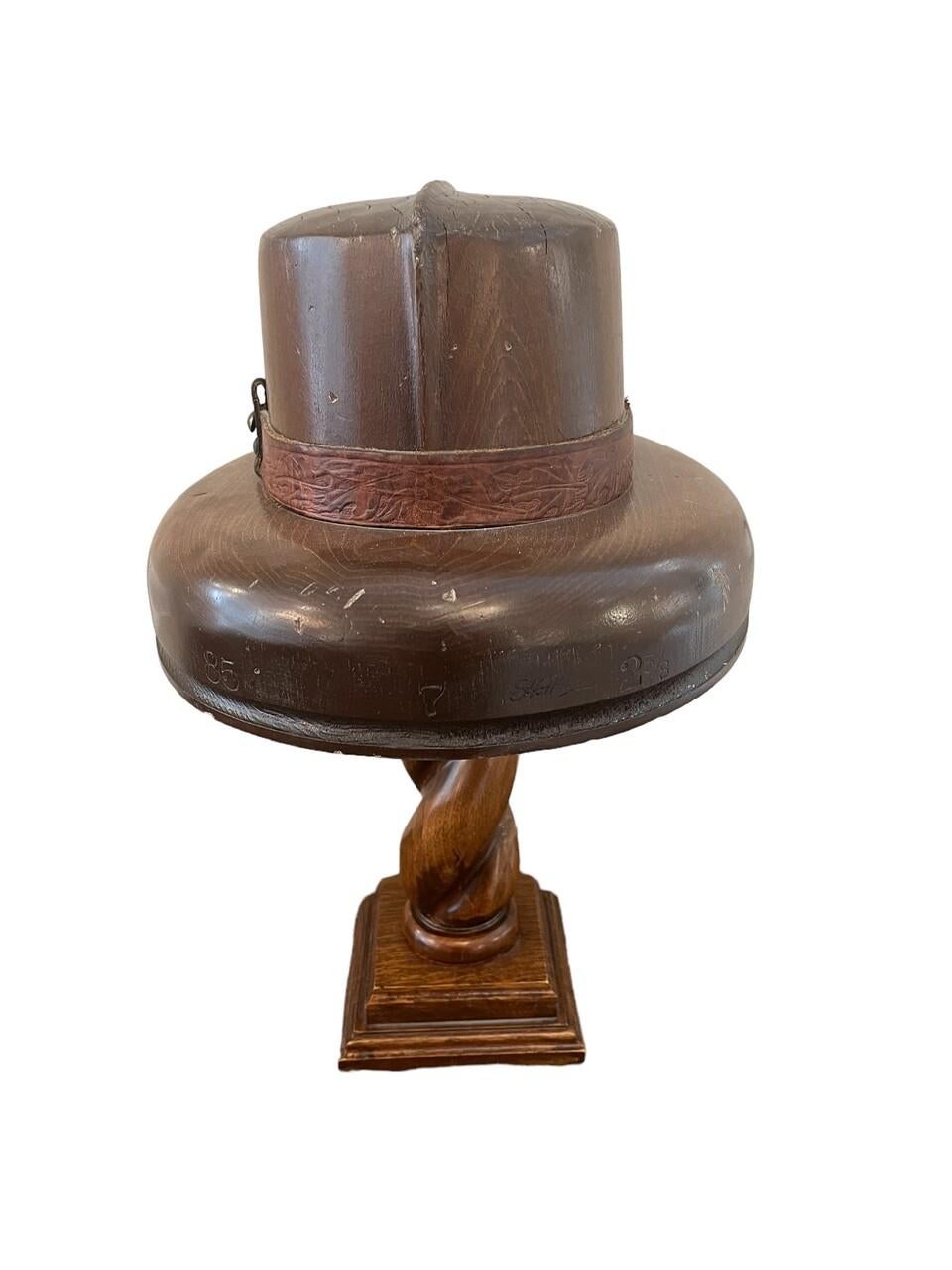 English wood hat mold on wood stand.
Men’s brimmed hat with leather detail
circa 1910-1920